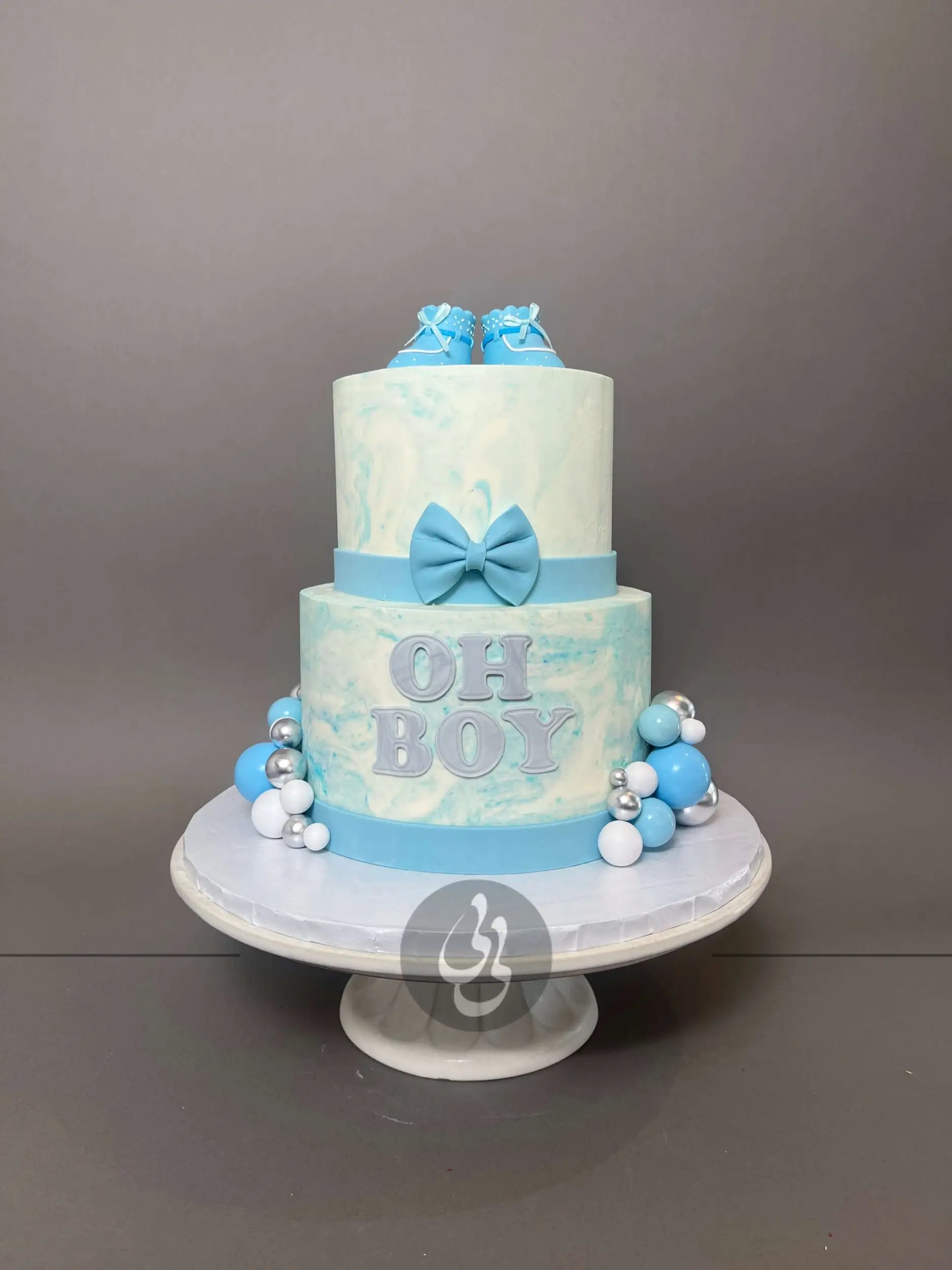 Oh baby booties on marble buttercream - custom cake