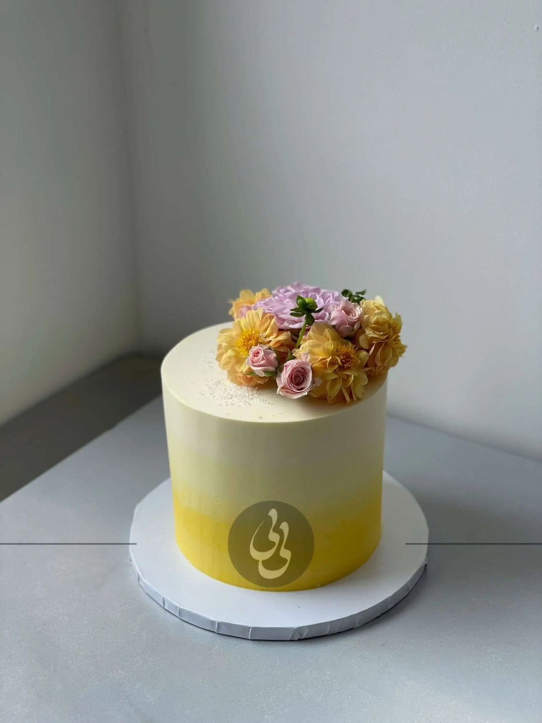Ombre with fresh flowers on buttercream - custom cake