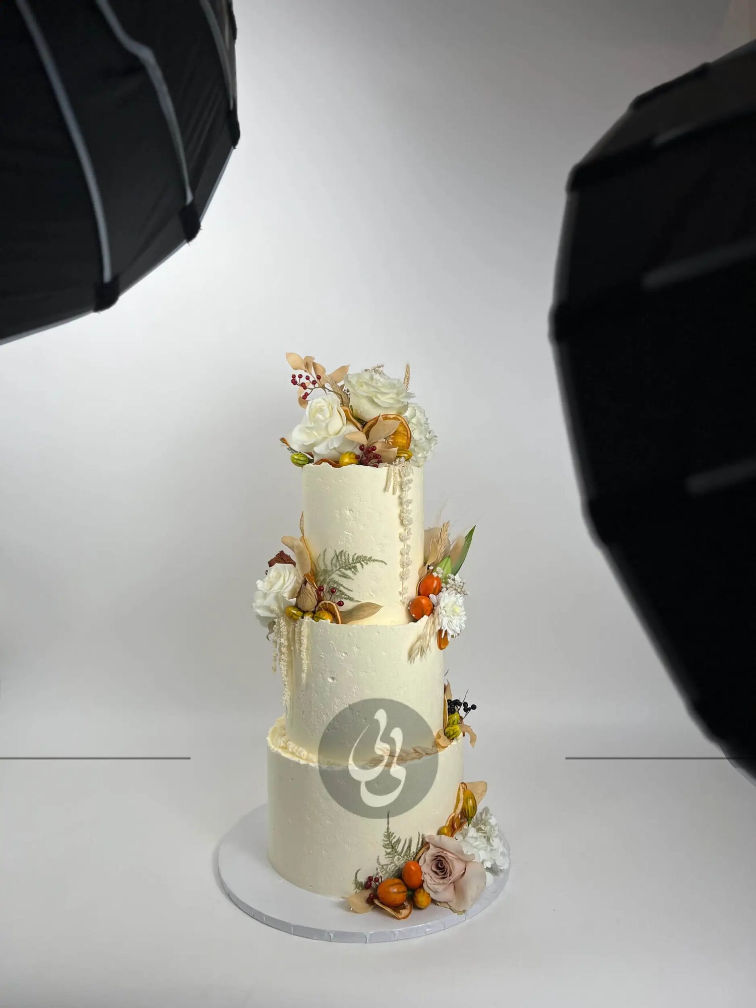 Seasonal fruits & fresh flowers on deckled edge buttercream - wedding cake
