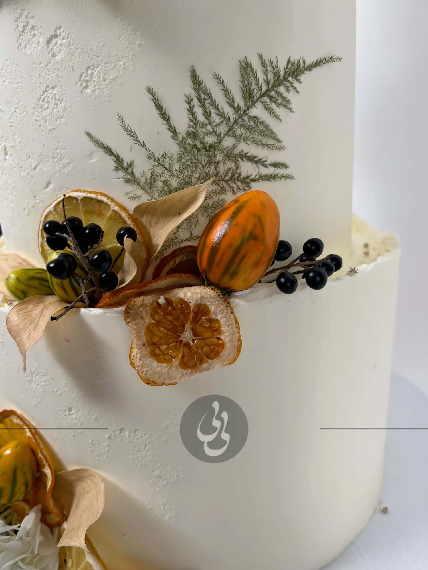 Seasonal fruits & fresh flowers on deckled edge buttercream - wedding cake