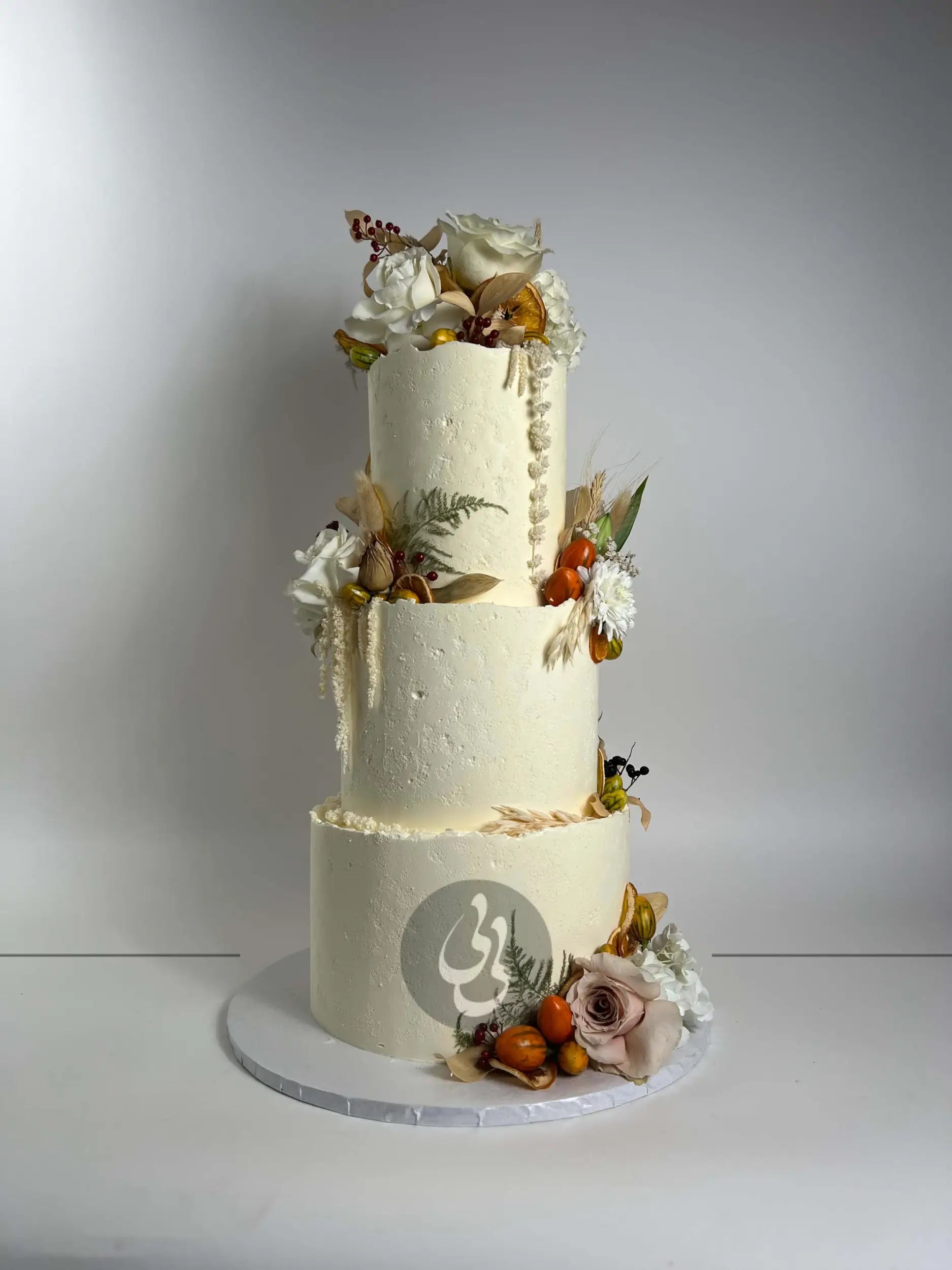 Seasonal fruits & fresh flowers on deckled edge buttercream - wedding cake