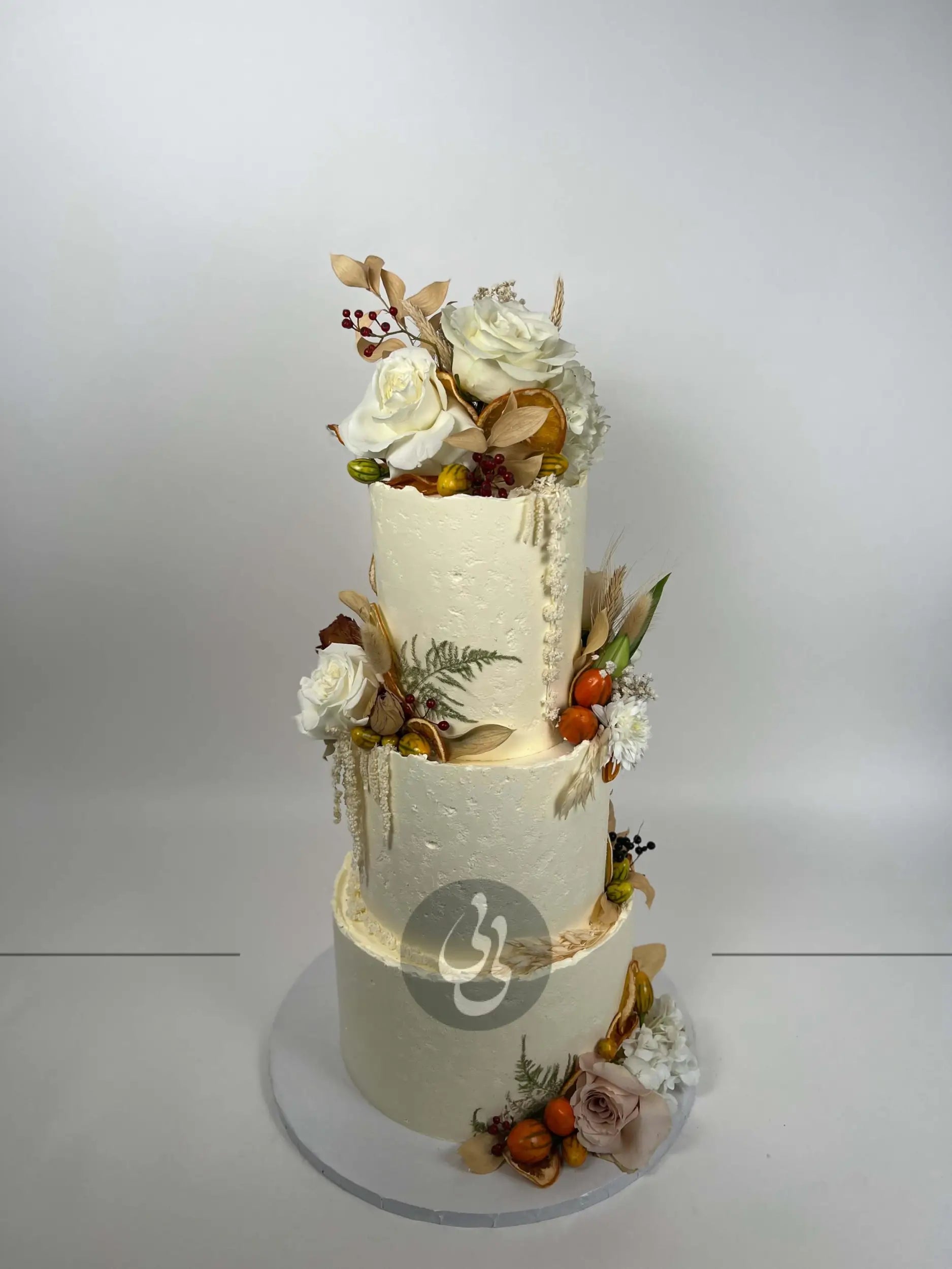Seasonal fruits & fresh flowers on deckled edge buttercream - wedding cake