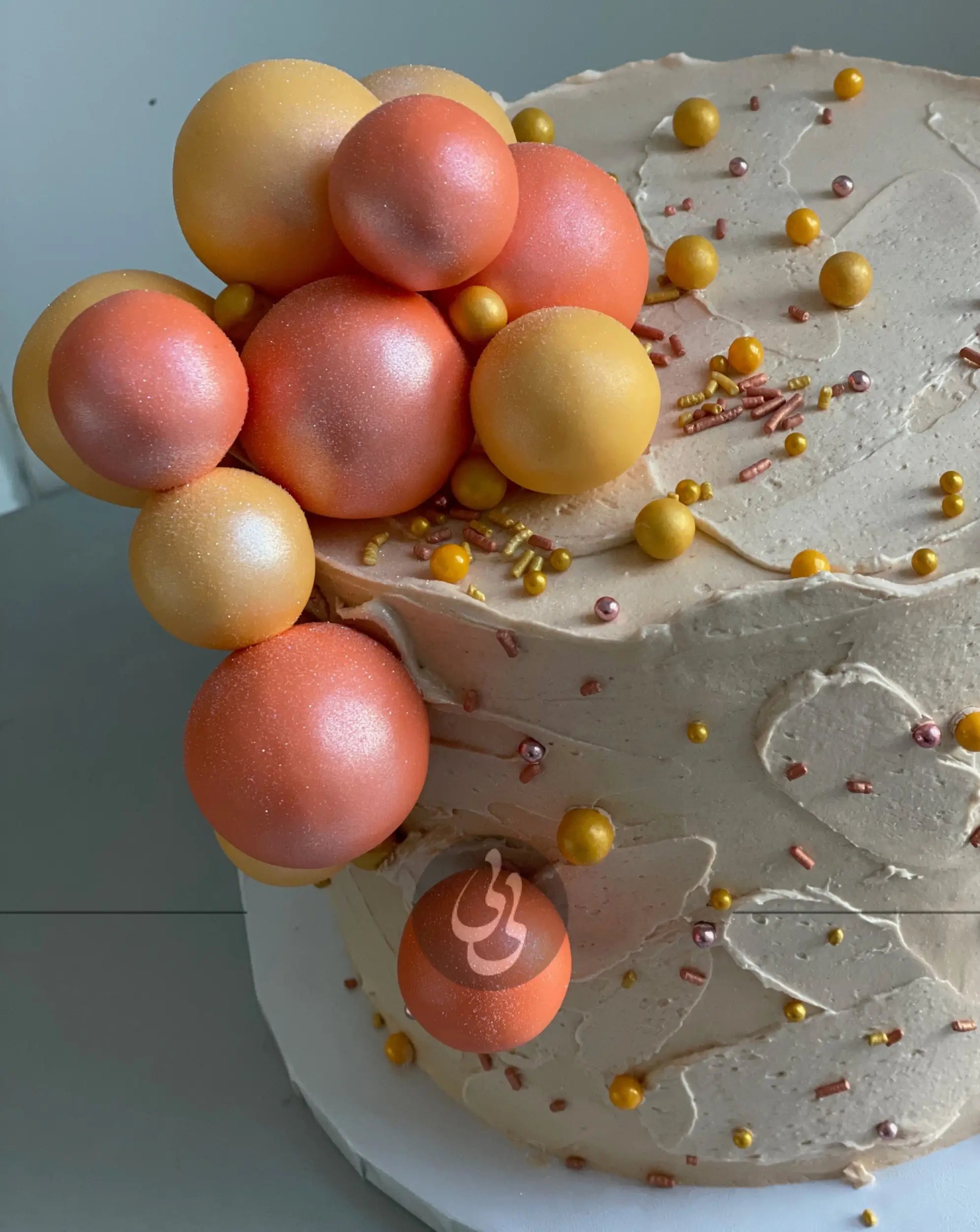 Splashed & textured spheres on buttercream - custom cake