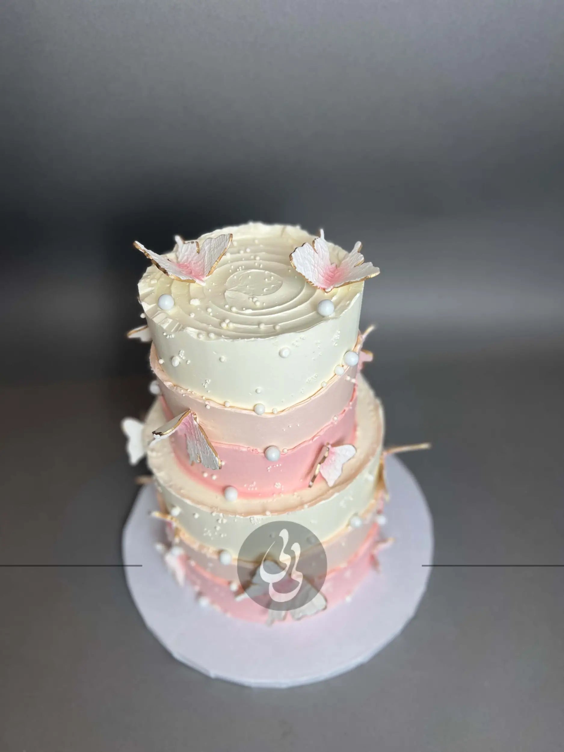 Sugar butterflies on layered buttercream - custom cake