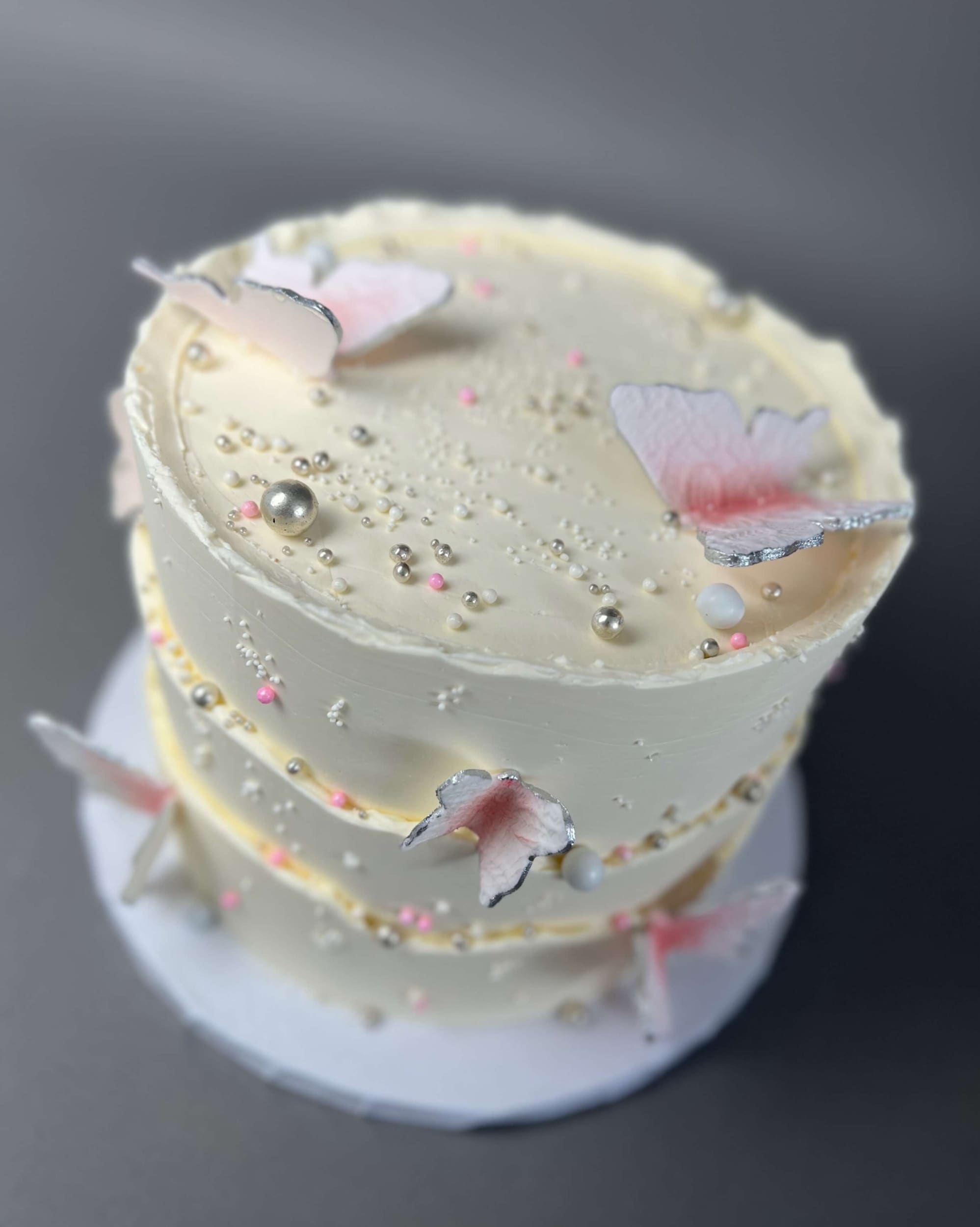 Sugar butterflies on layered buttercream - custom cake