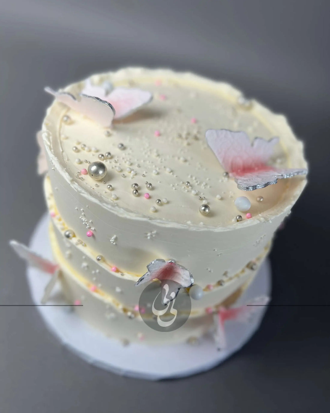 Sugar butterflies on layered buttercream - custom cake