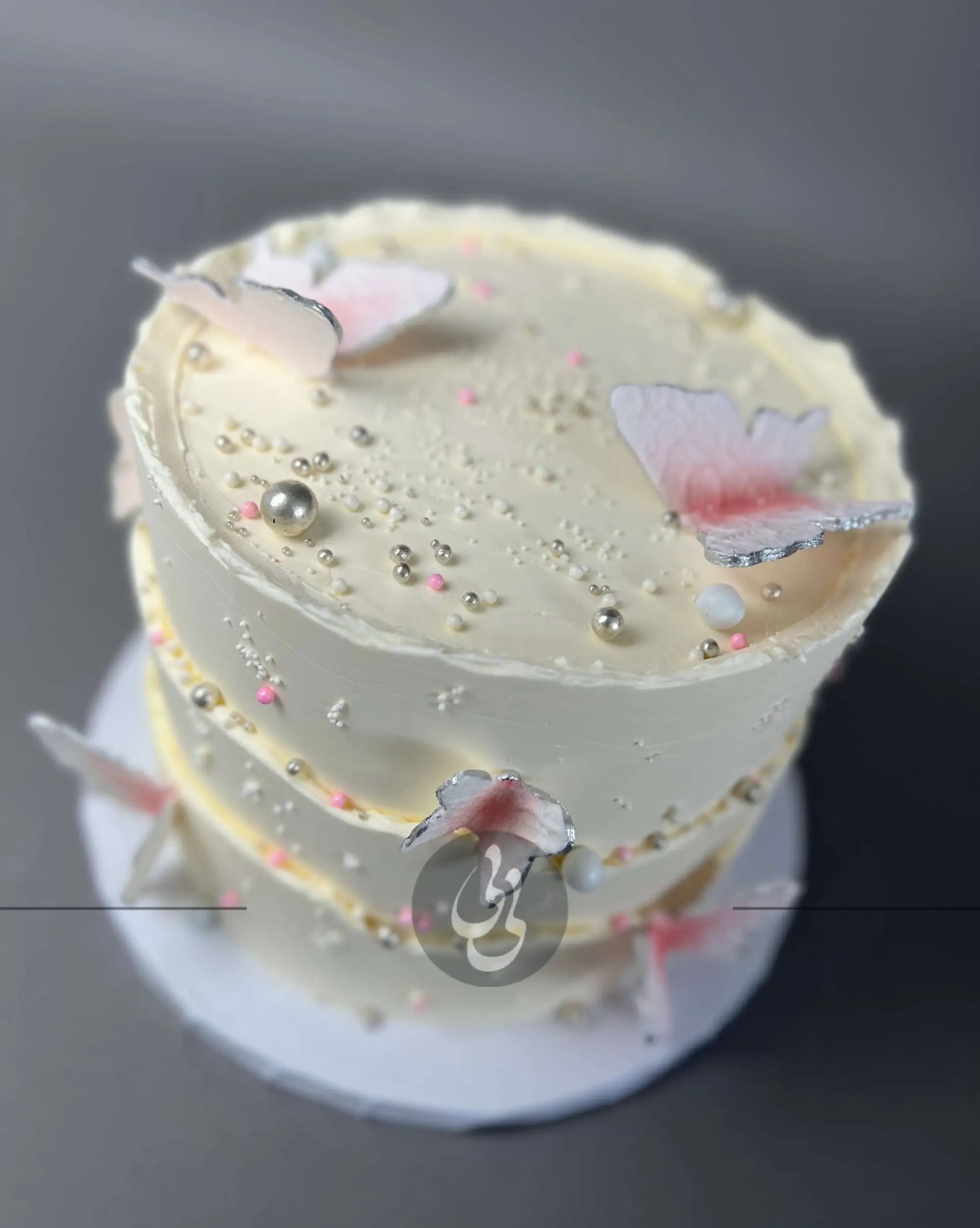 Sugar butterflies on layered buttercream - custom cake