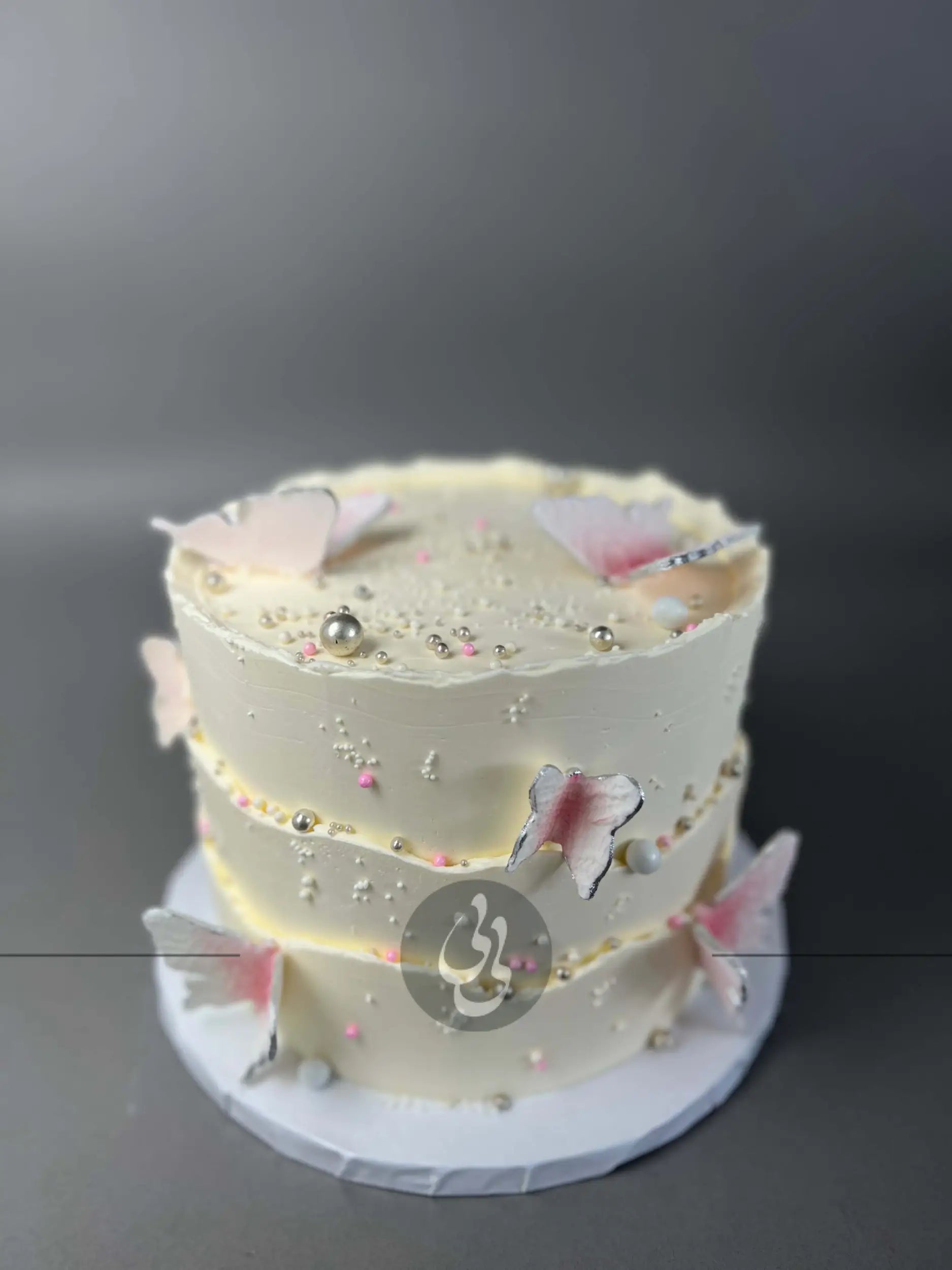 Sugar butterflies on layered buttercream - custom cake