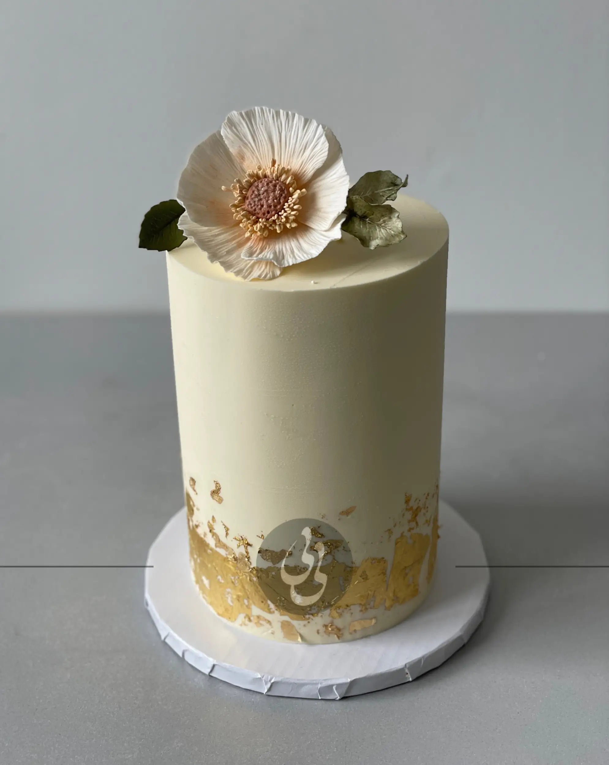 Sugar flower & gold foil on buttercream - custom cake