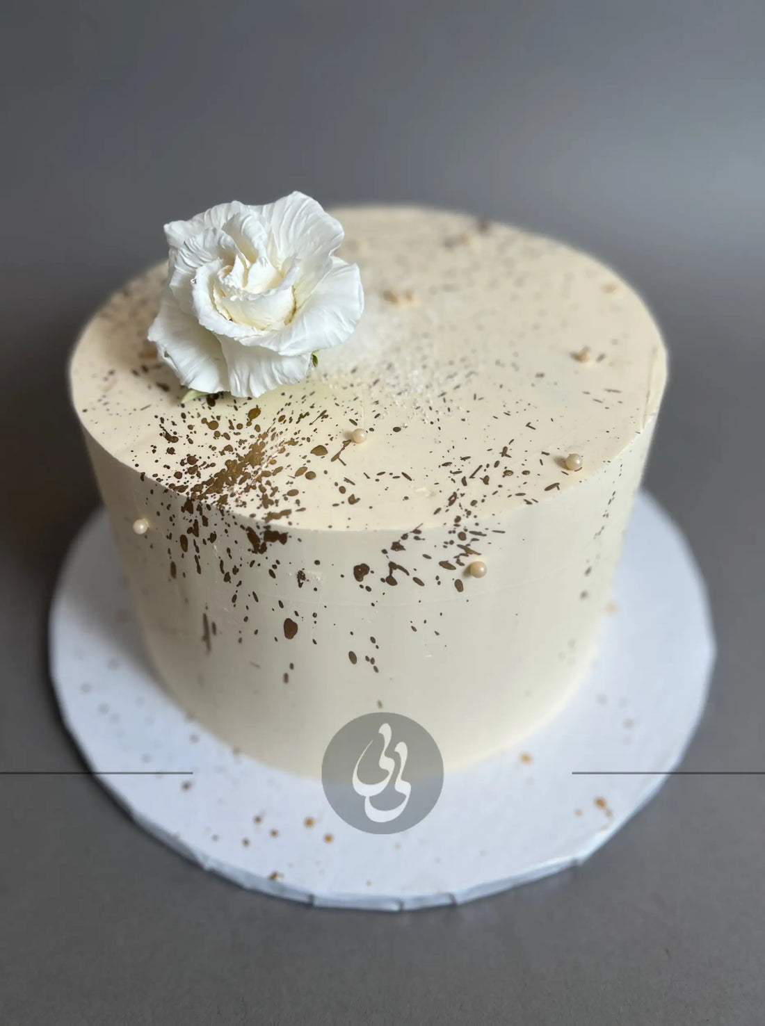 Sugar flowers & gold splatter on buttercream - custom cake