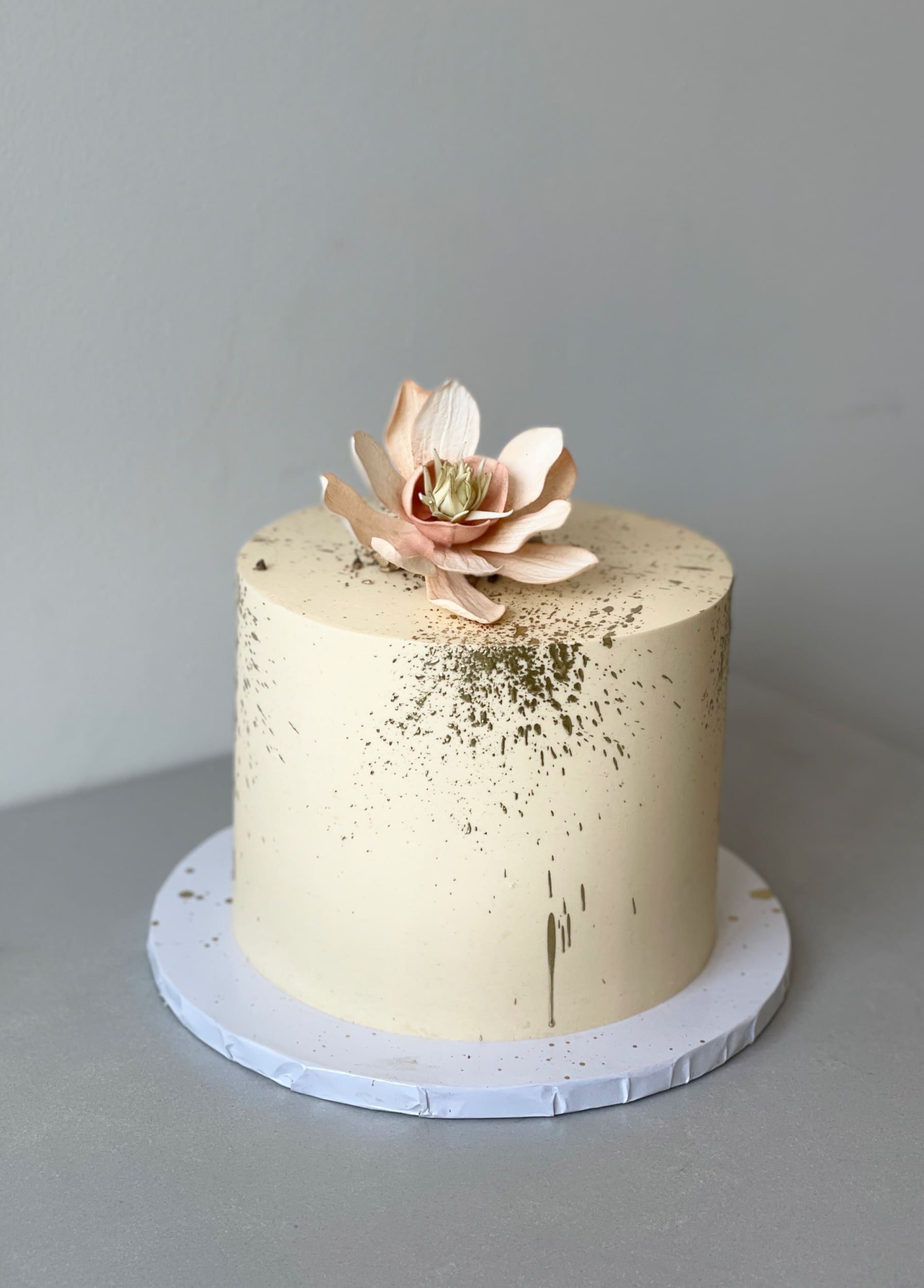 Sugar flowers & gold splatter on buttercream - custom cake