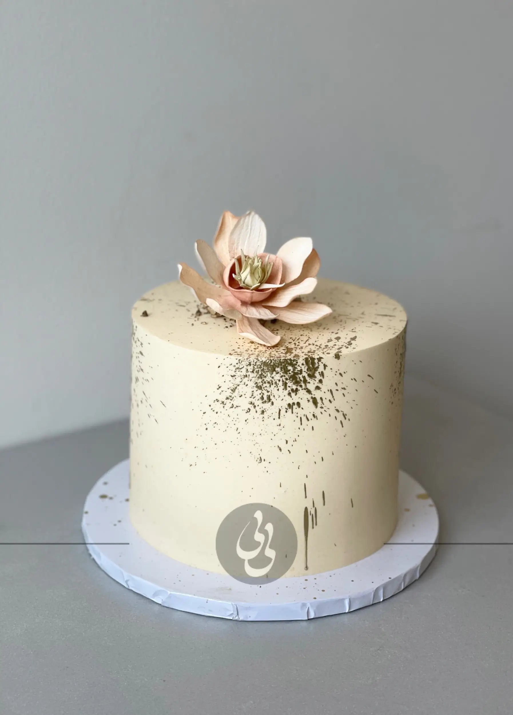 Sugar flowers & gold splatter on buttercream - custom cake