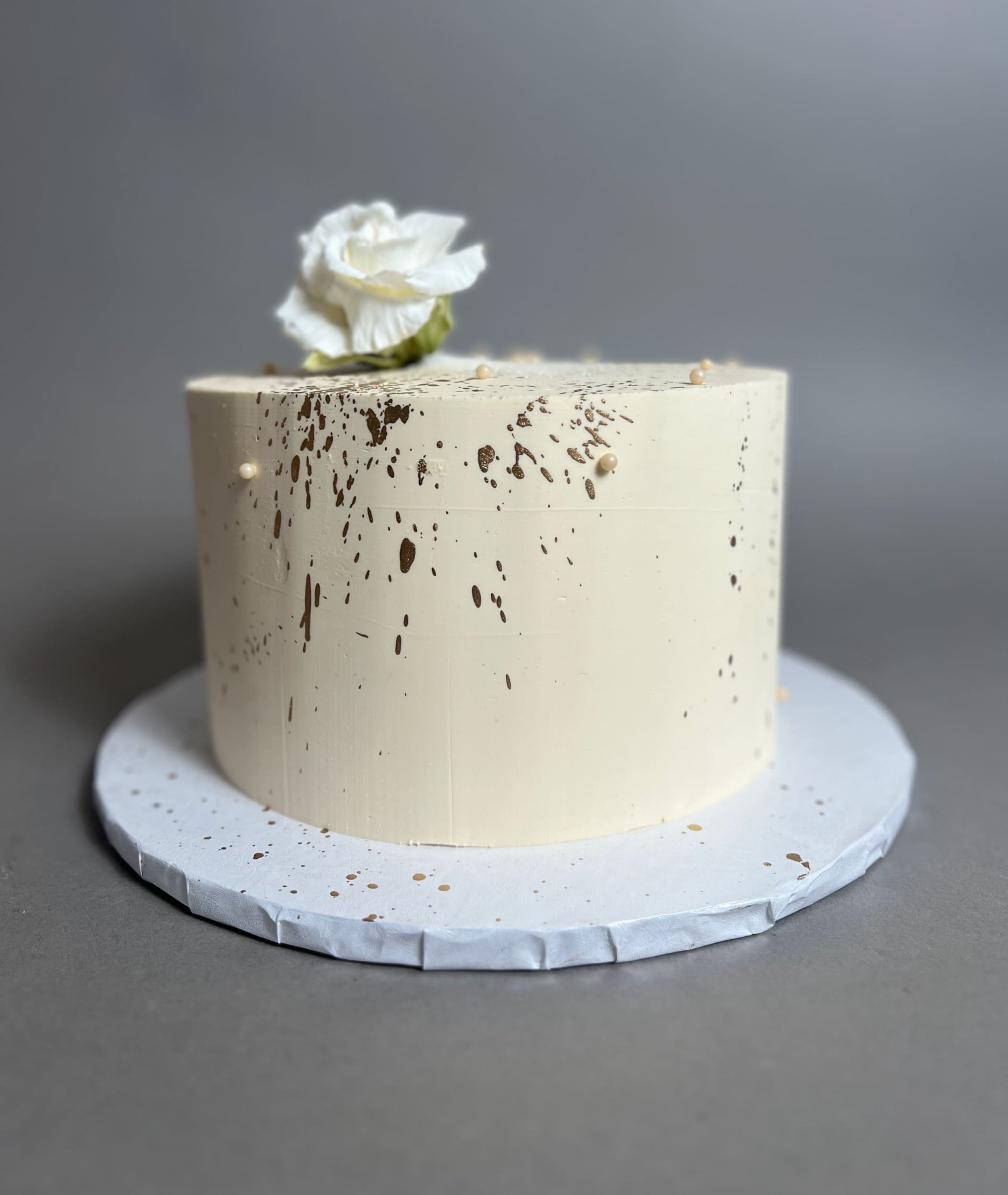 Sugar flowers & gold splatter on buttercream - custom cake