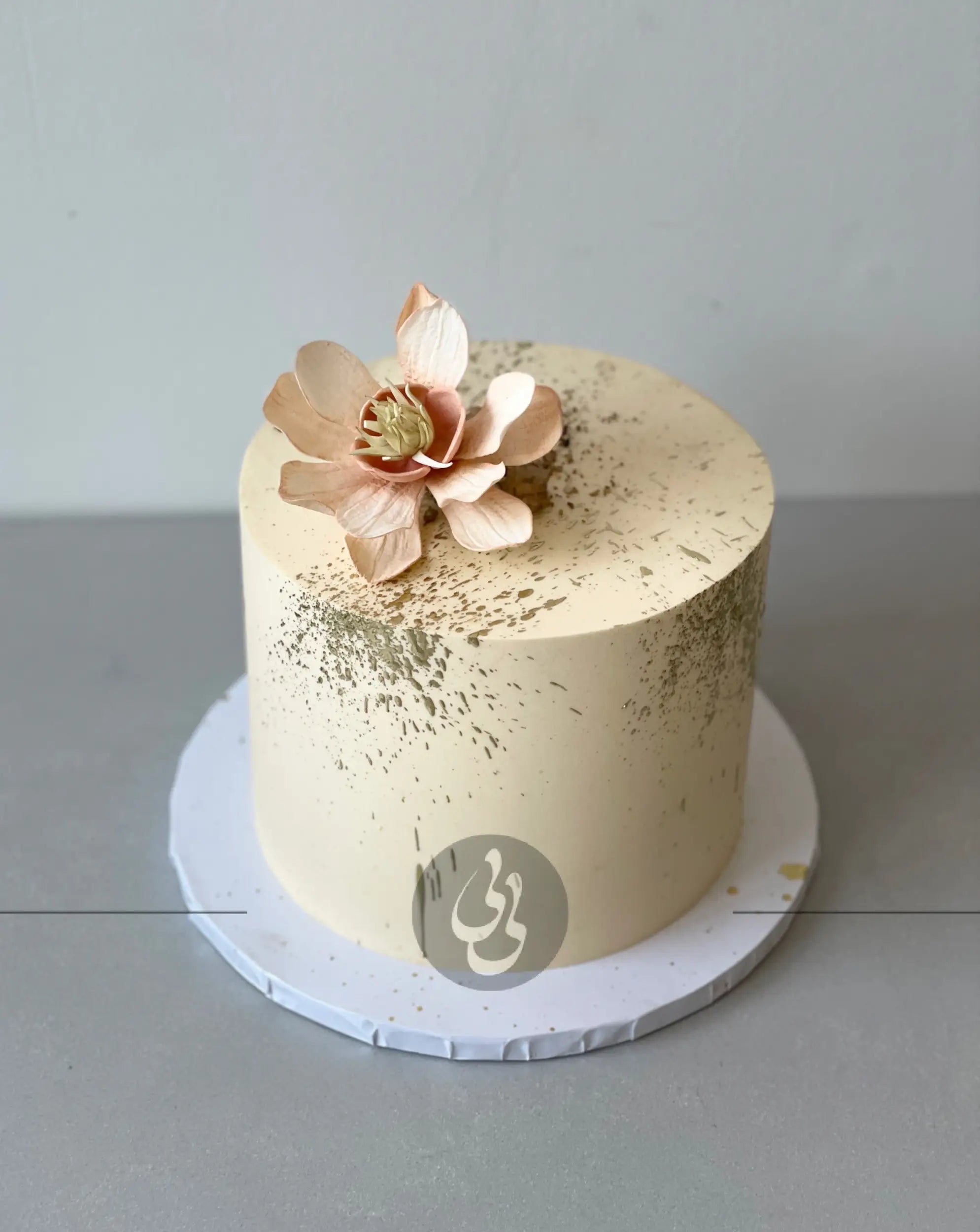 Sugar flowers & gold splatter on buttercream - custom cake