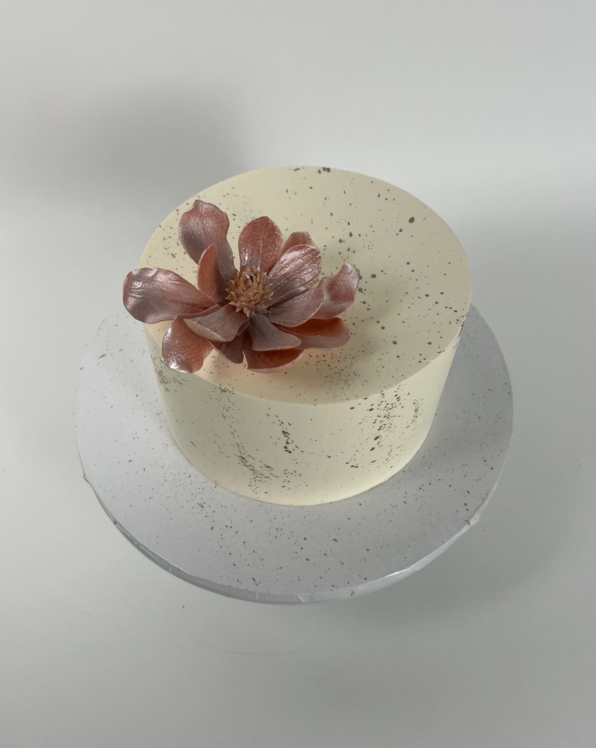 Sugar flowers & gold splatter on buttercream - custom cake