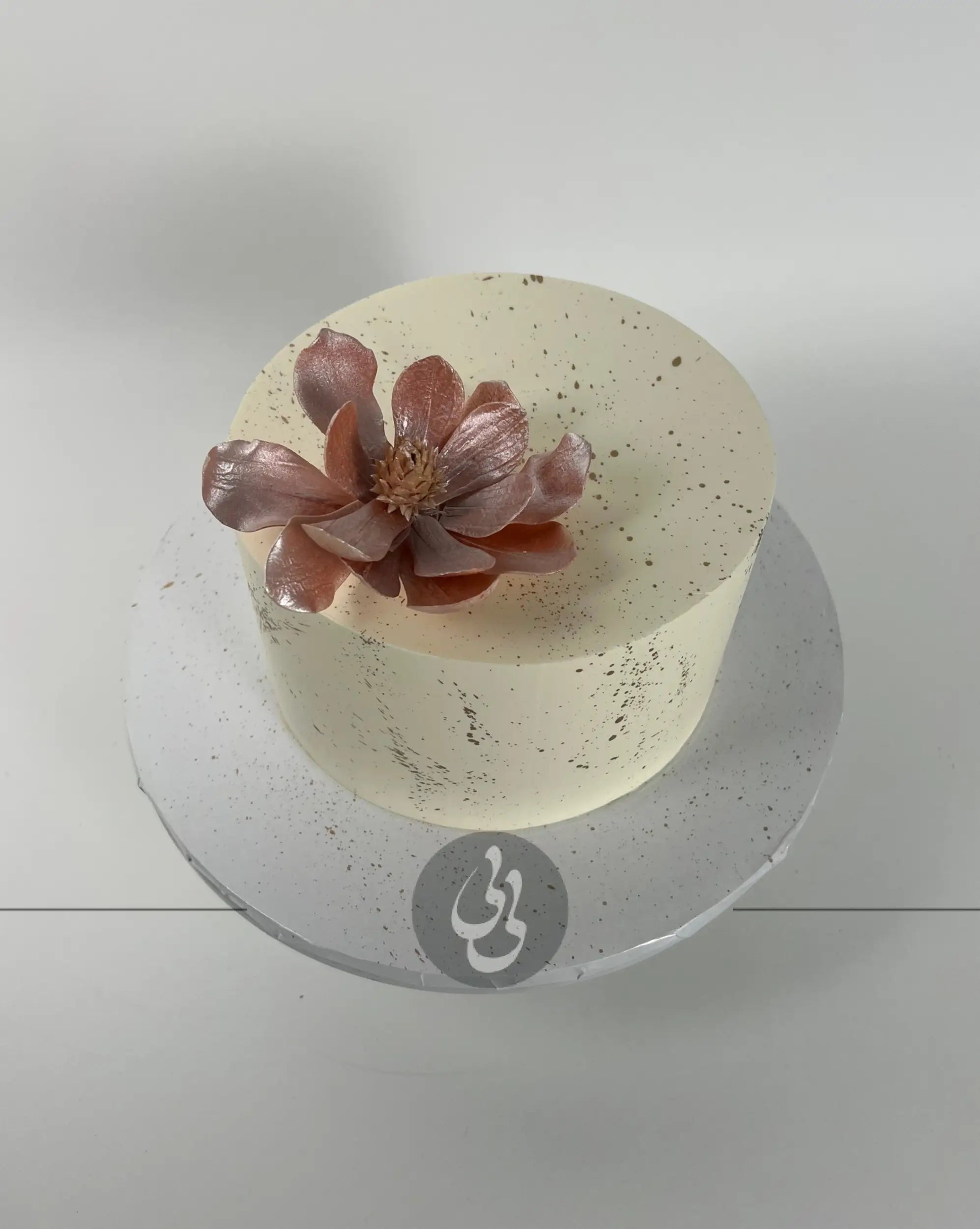 Sugar flowers & gold splatter on buttercream - custom cake