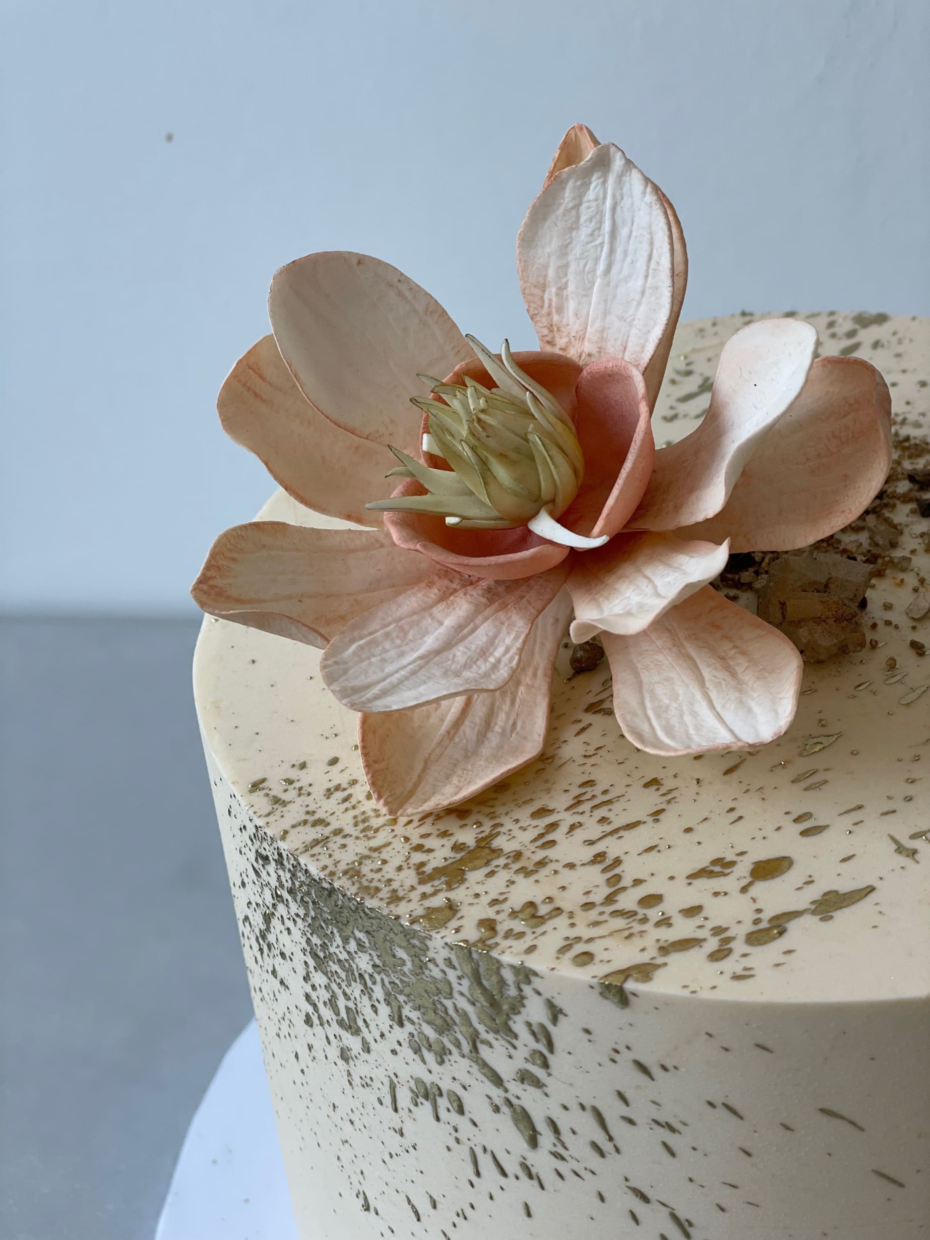 Sugar flowers & gold splatter on buttercream - custom cake