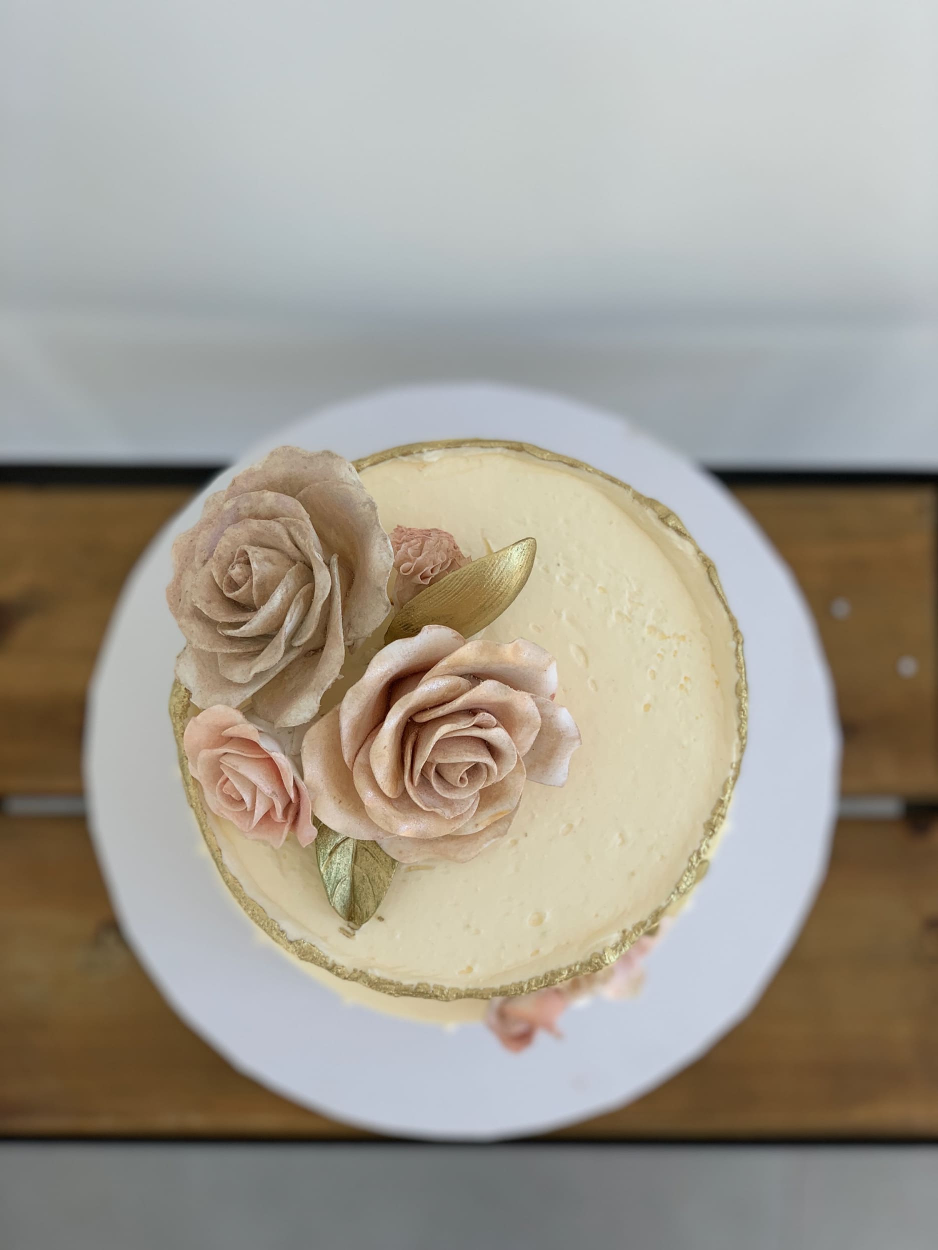 Sugar flowers on golden deckled edge buttercream - custom cake