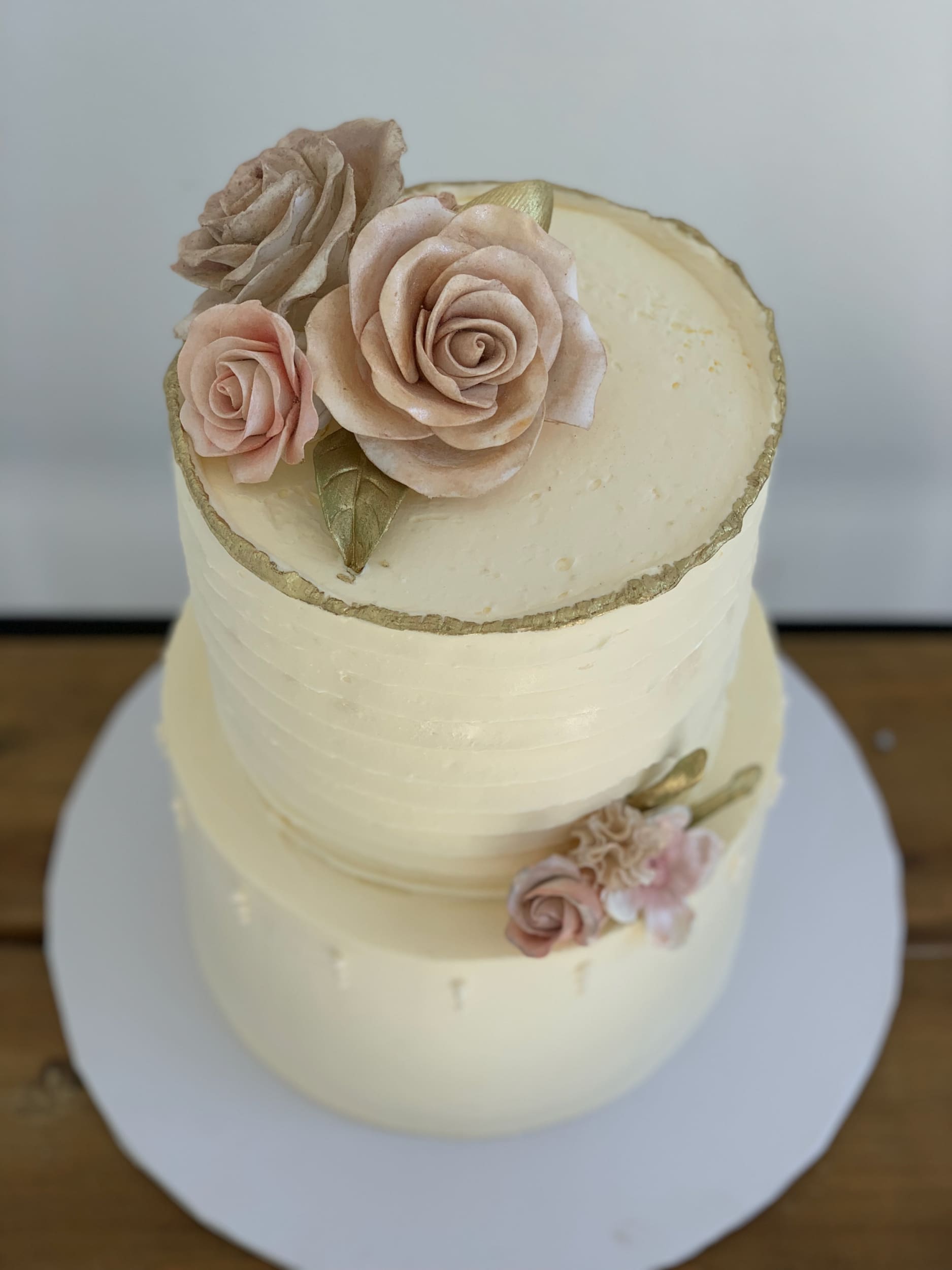 Sugar flowers on golden deckled edge buttercream - custom cake