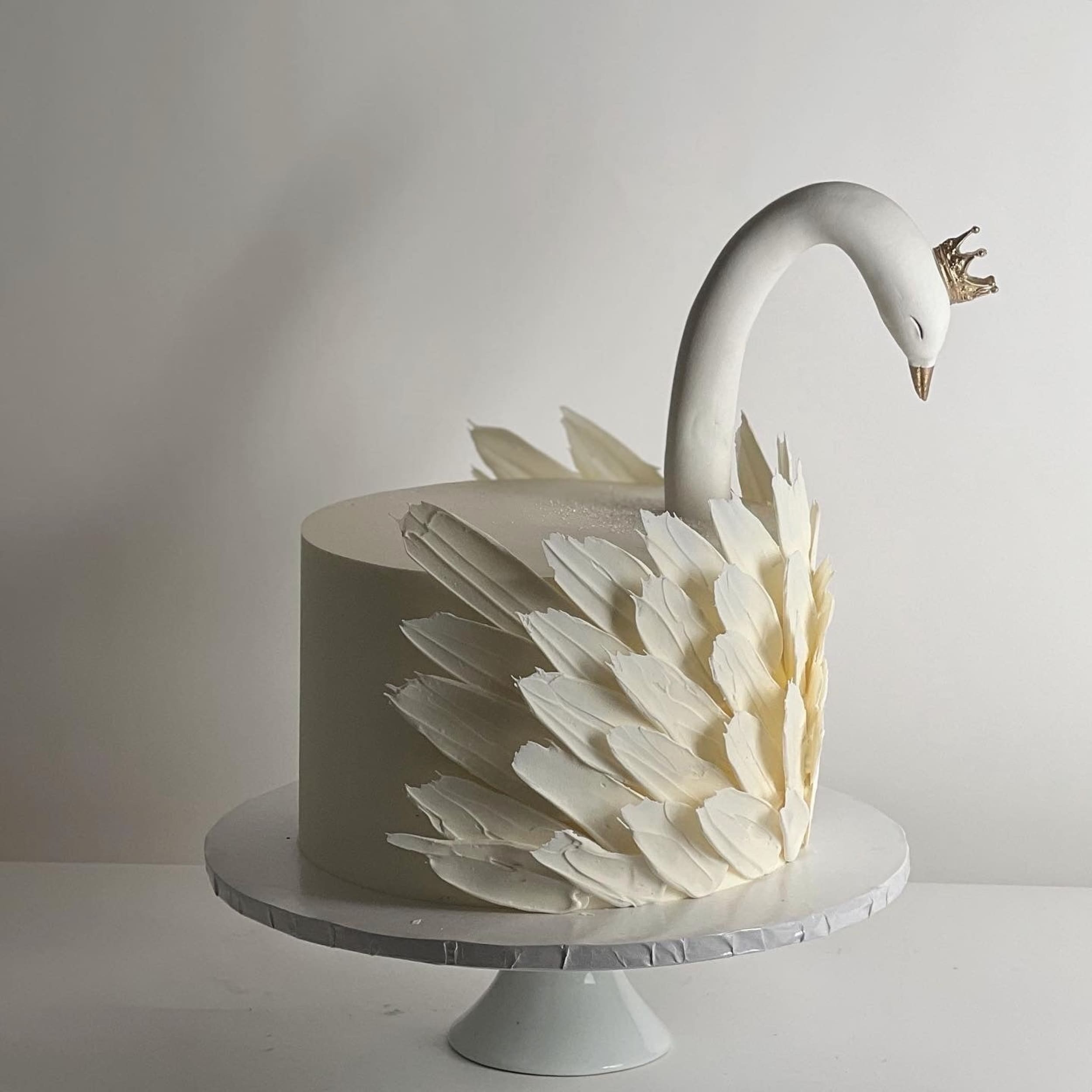 Swan & chocolate feathers on buttercream - custom cake
