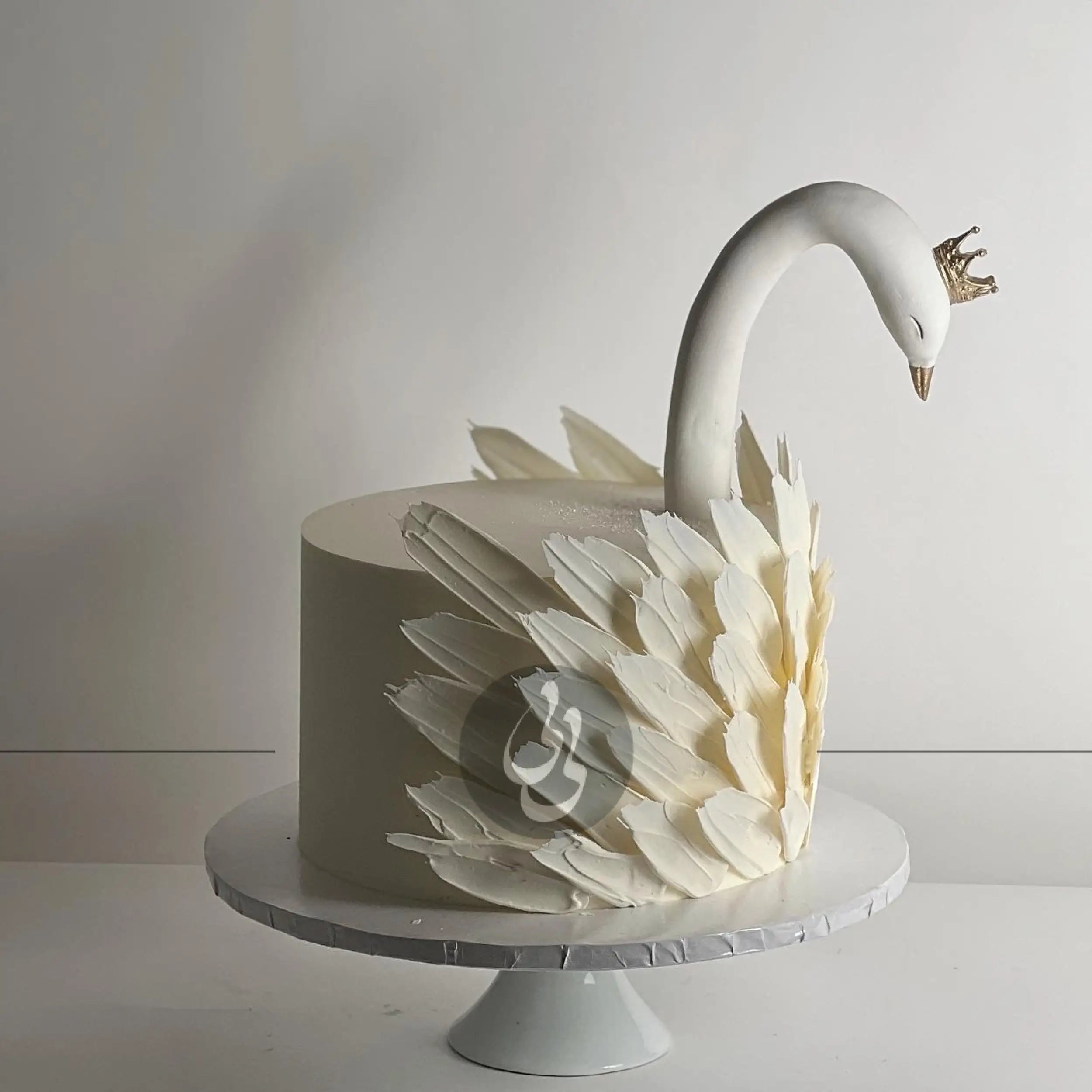Swan & chocolate feathers on buttercream - custom cake