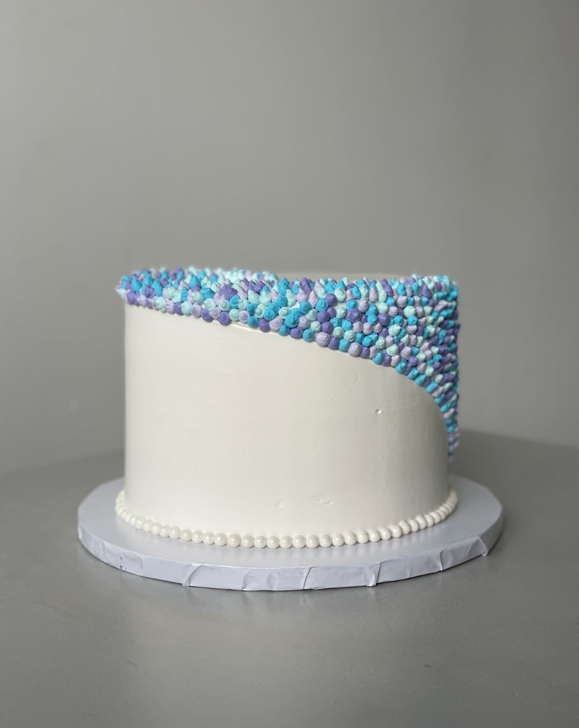 Swirl dots in whipped cream - custom cake