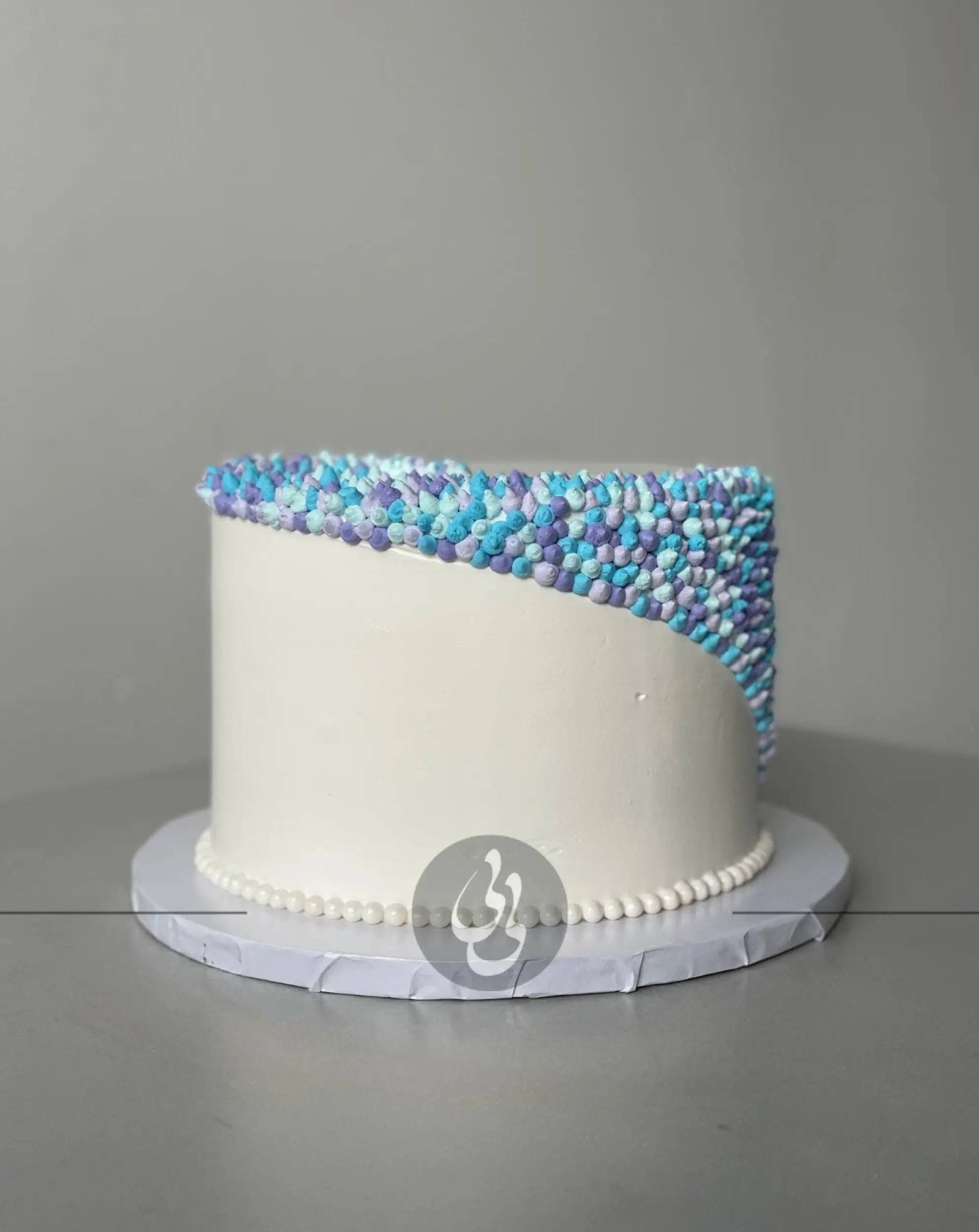Swirl dots in whipped cream - custom cake