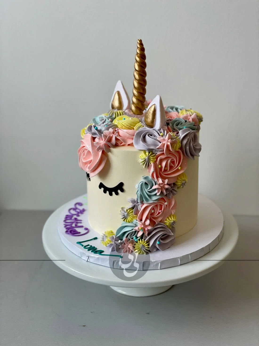 Unicorn face on buttercream - custom cake
