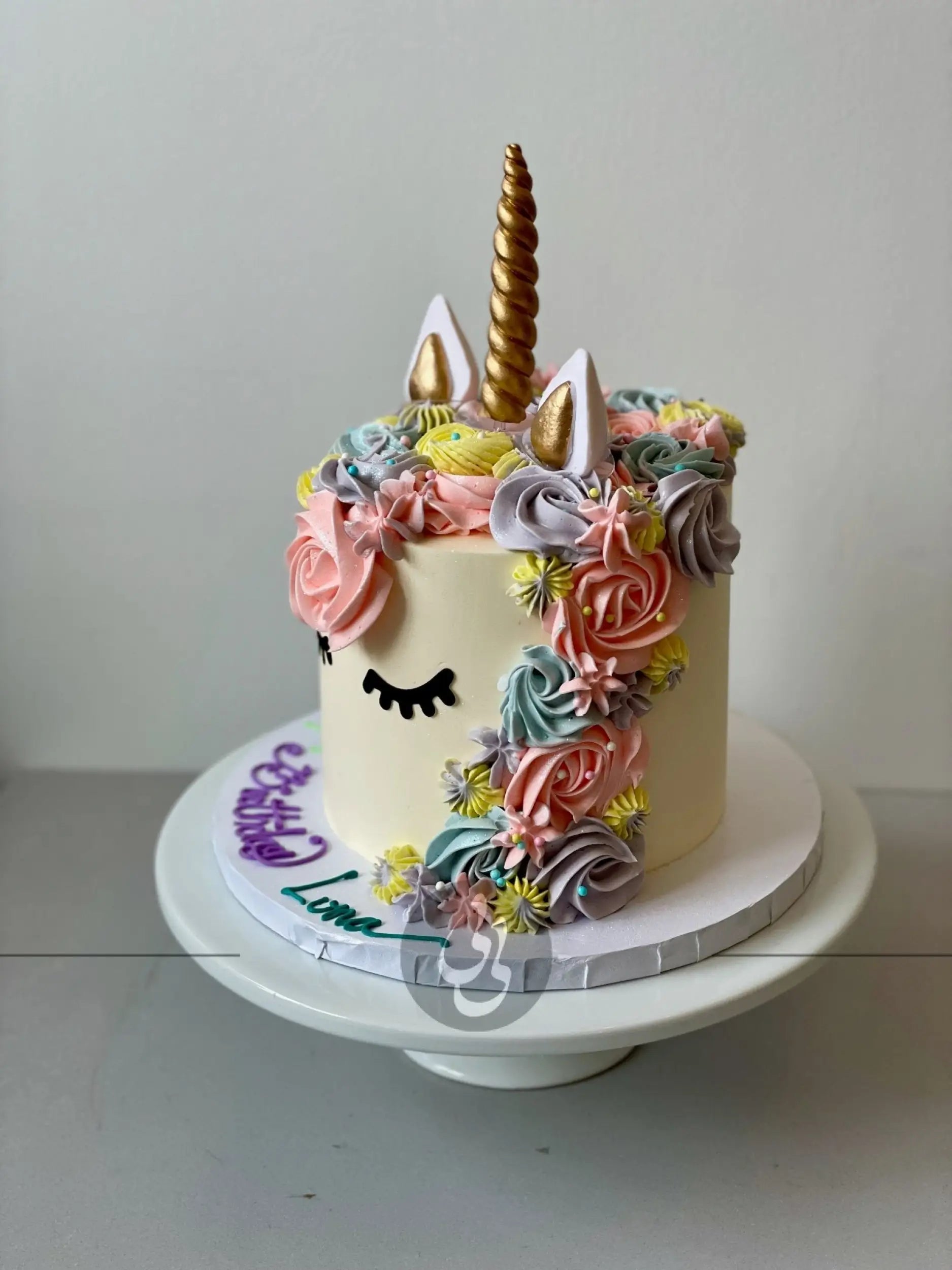 Unicorn face on buttercream - custom cake