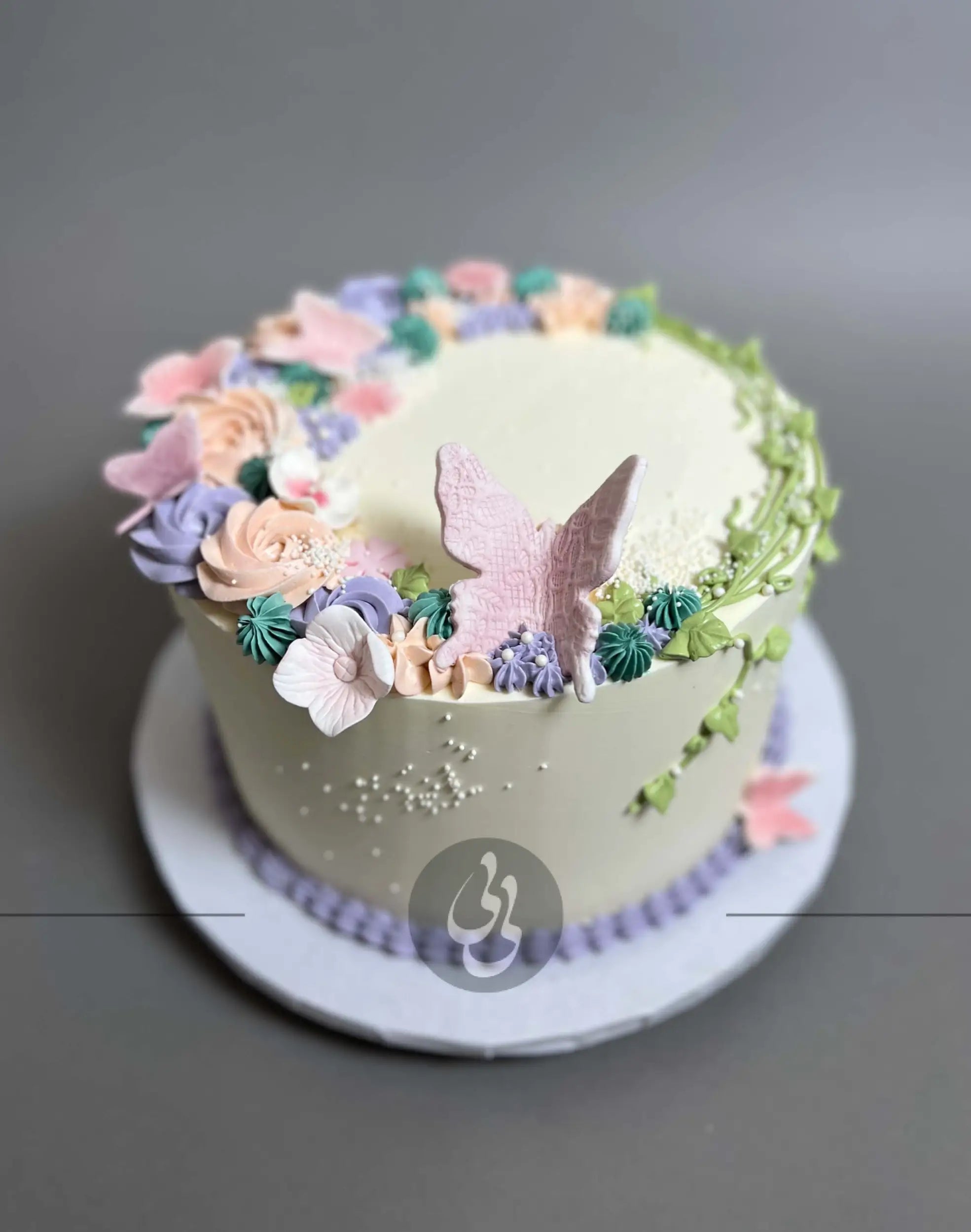 Vines and rosette butterfly on buttercream - custom cake