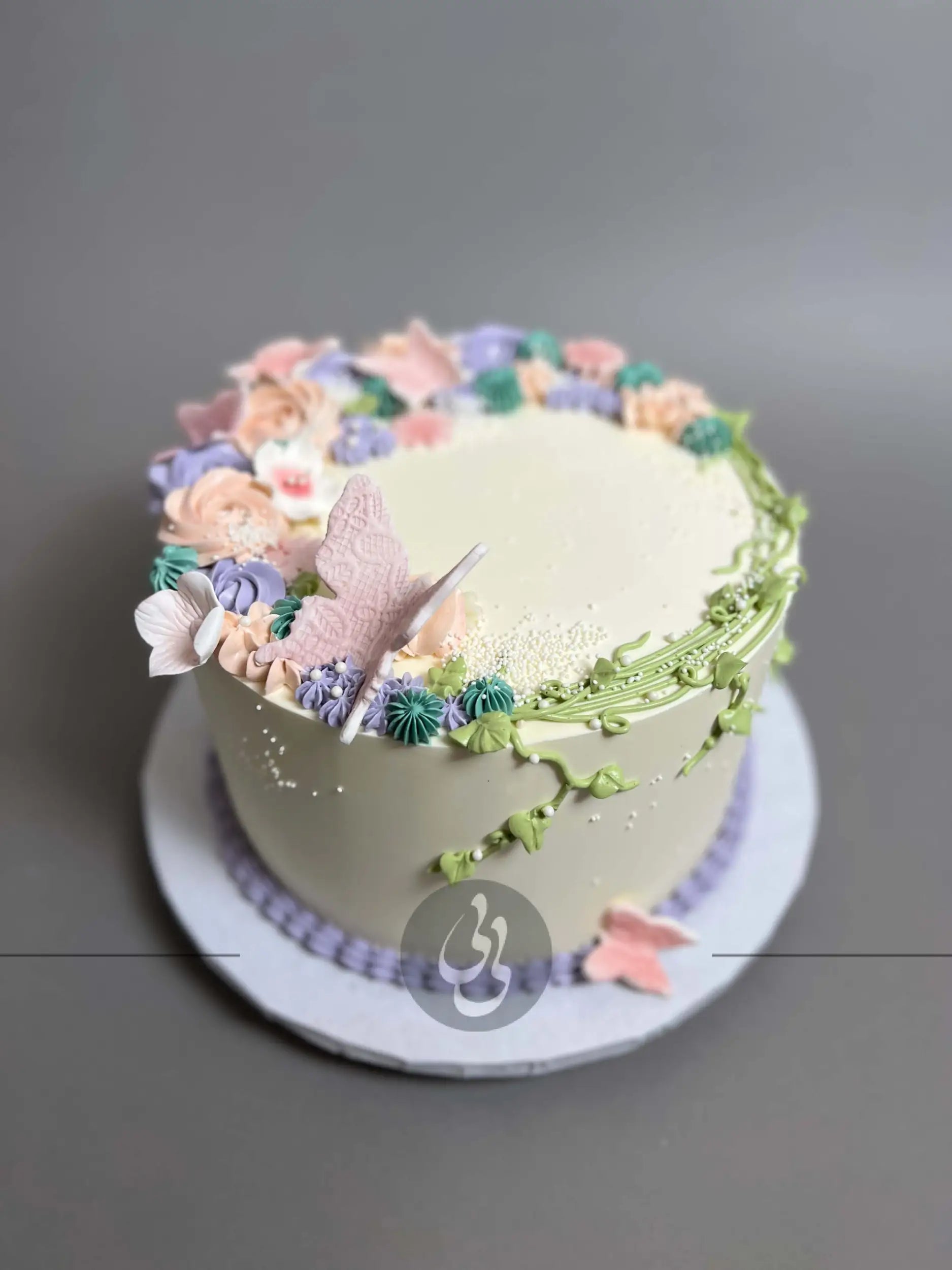Vines and rosette butterfly on buttercream - custom cake
