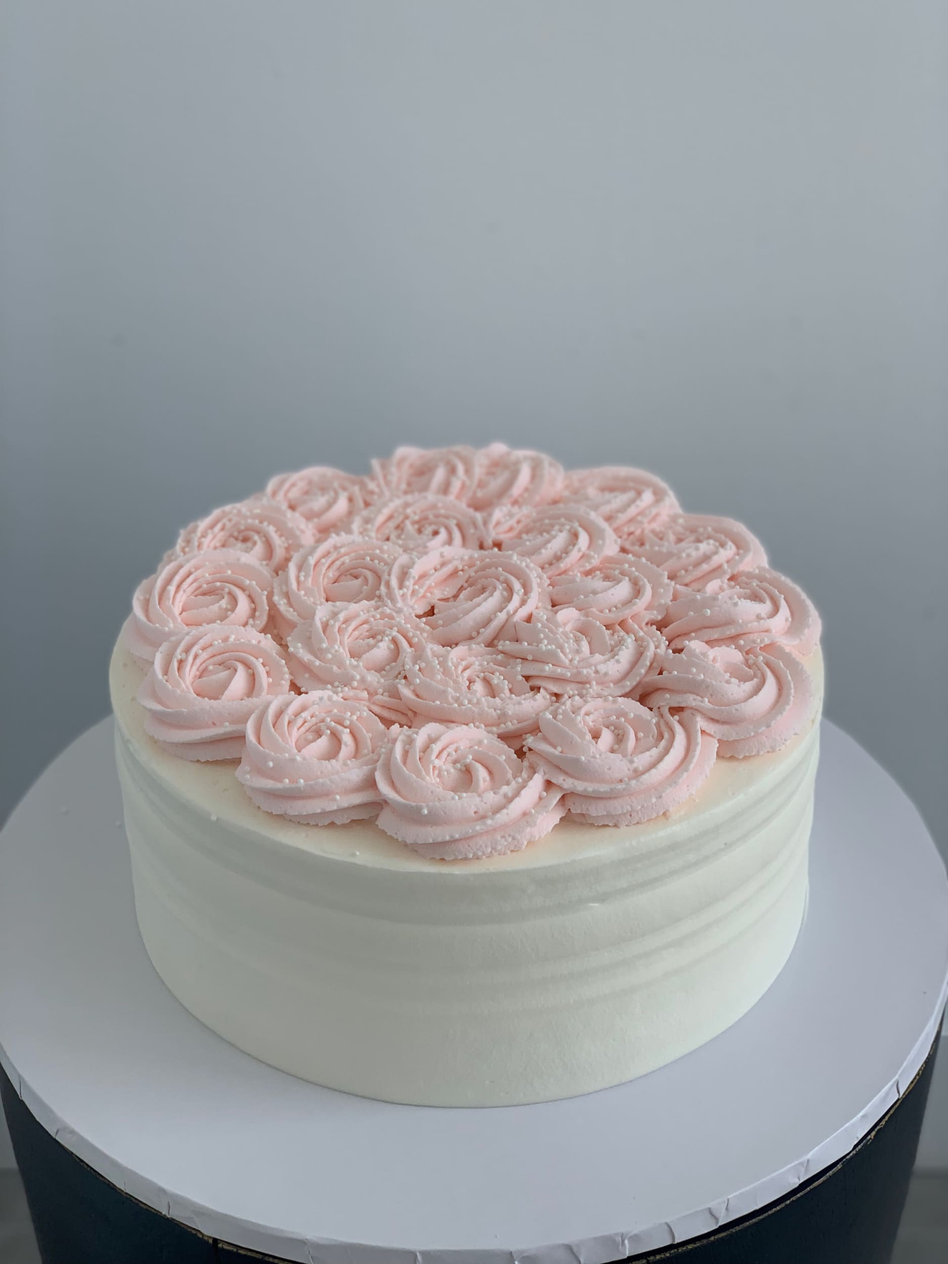 Whipped cream rosettes on top - custom cake