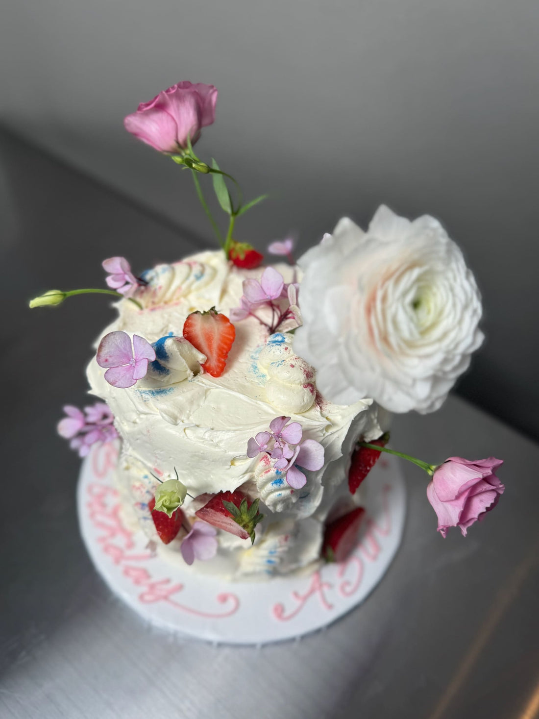 Wild fresh flowers & strawberries on buttercream - custom cake