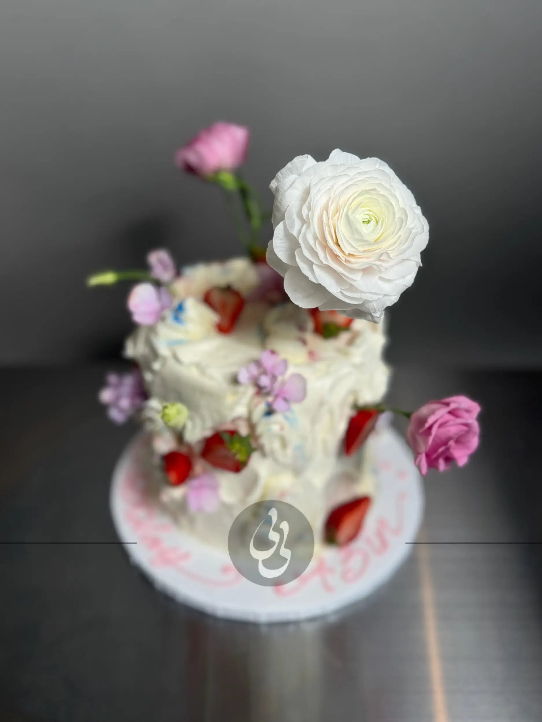 Wild fresh flowers & strawberries on buttercream - custom cake