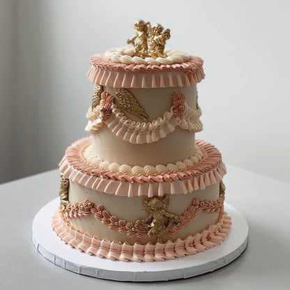 Angelic cherubs on vintage lambeth cake - custom cake