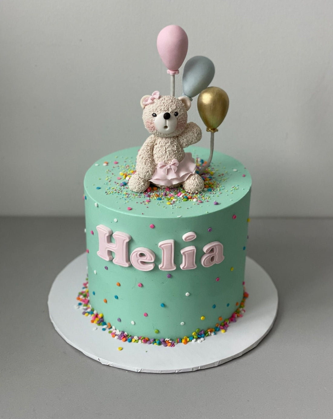 Animal & balloons on buttercream - custom cake