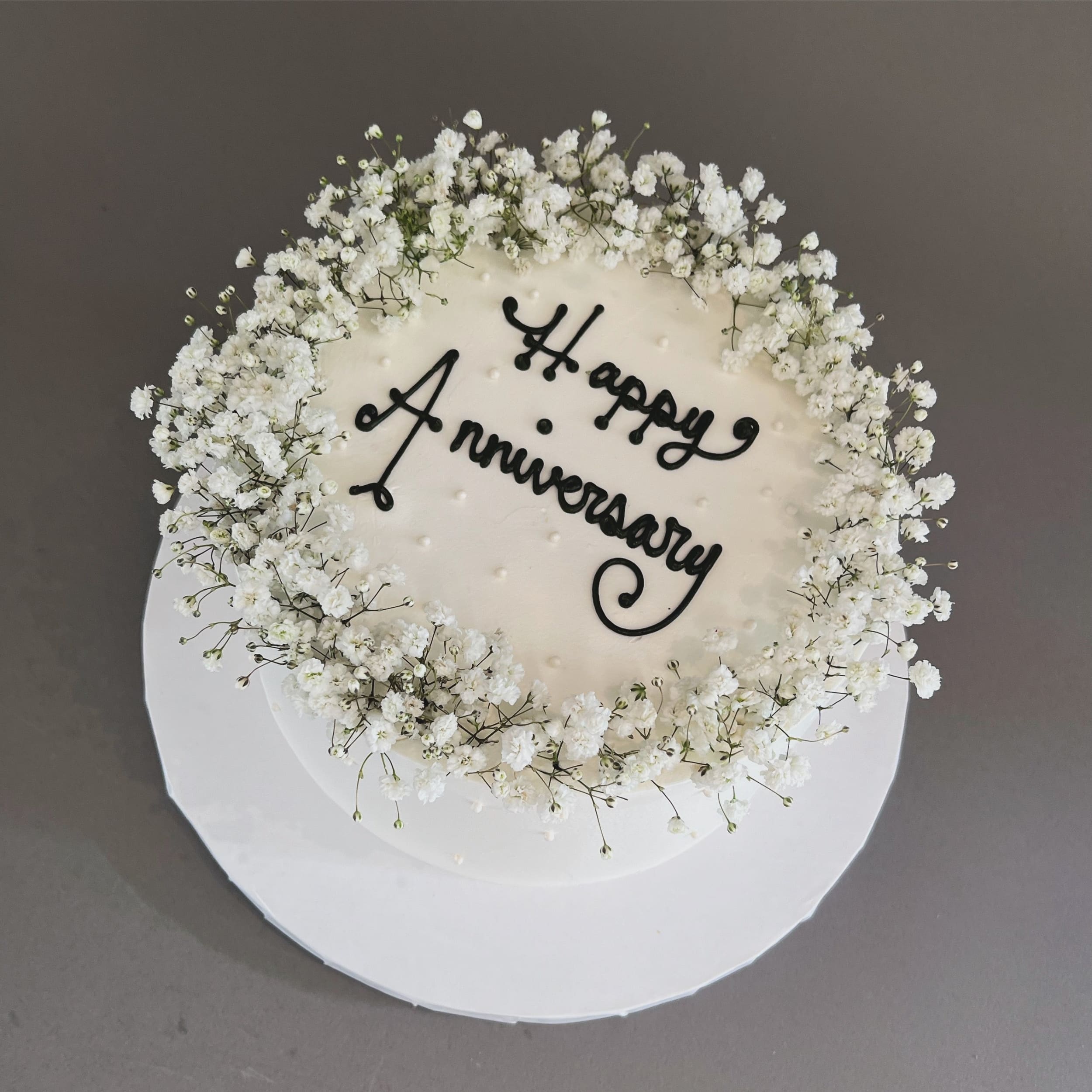 Baby’s breath on whipped cream - custom cake