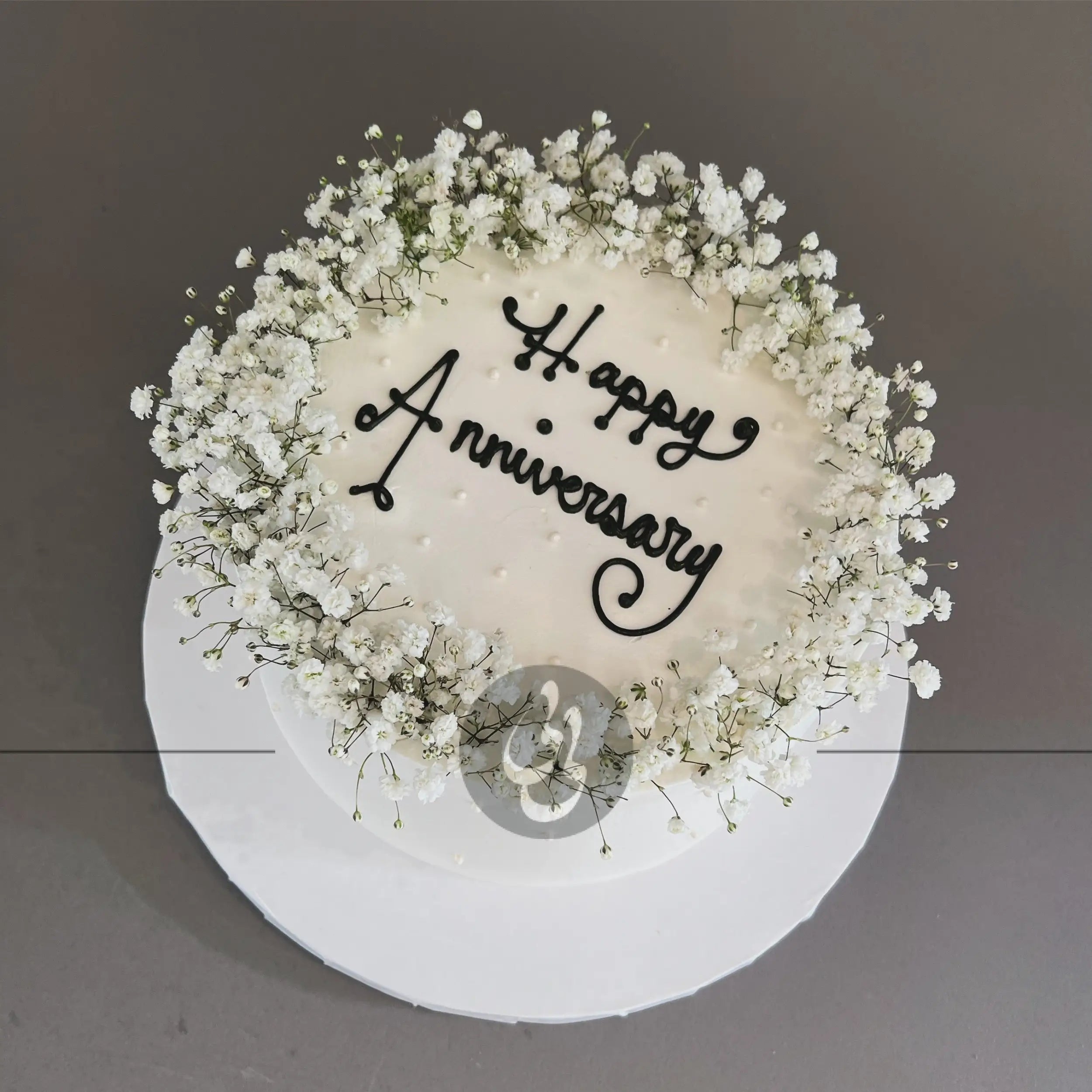 Baby’s breath on whipped cream - custom cake