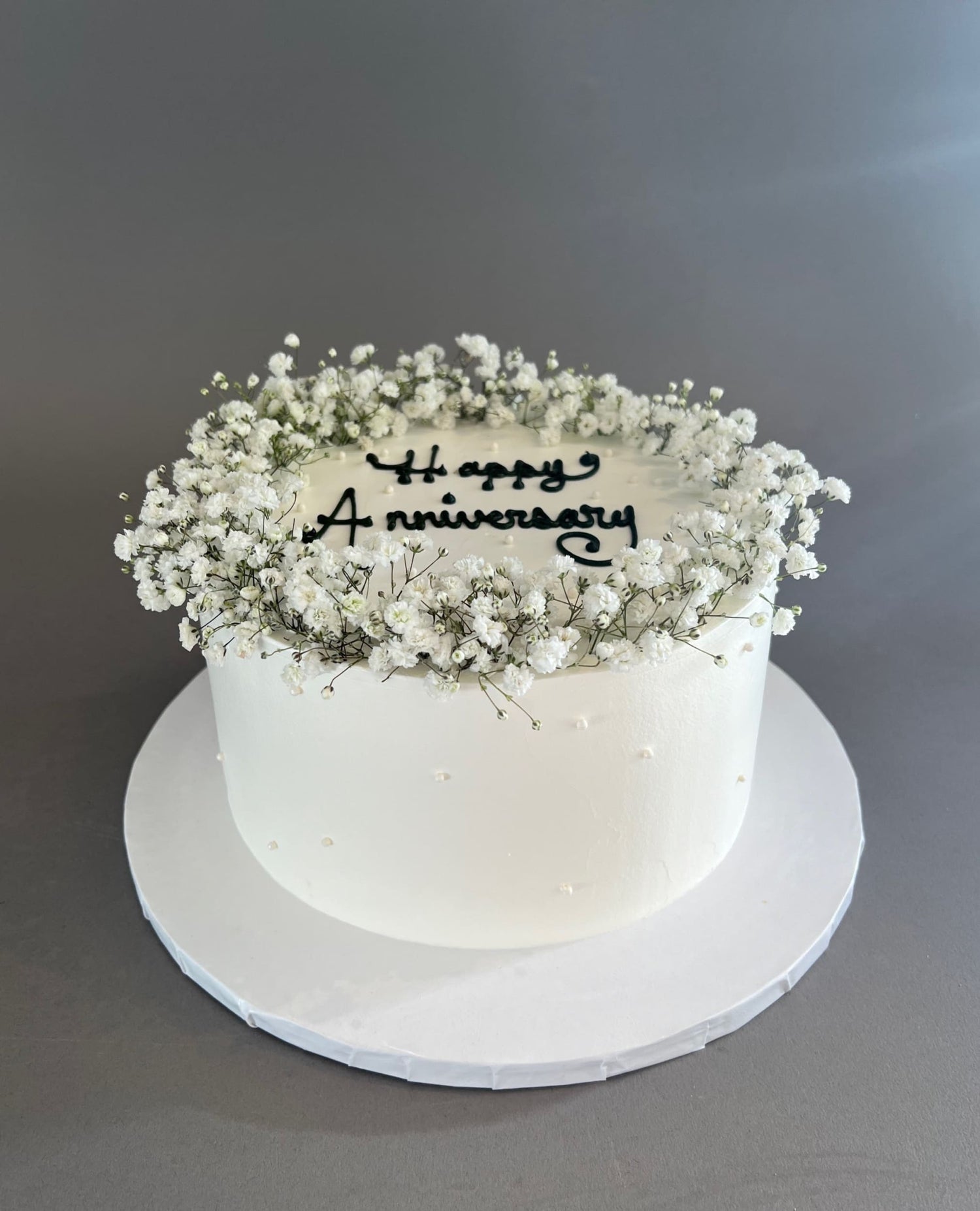 Baby’s breath on whipped cream - custom cake