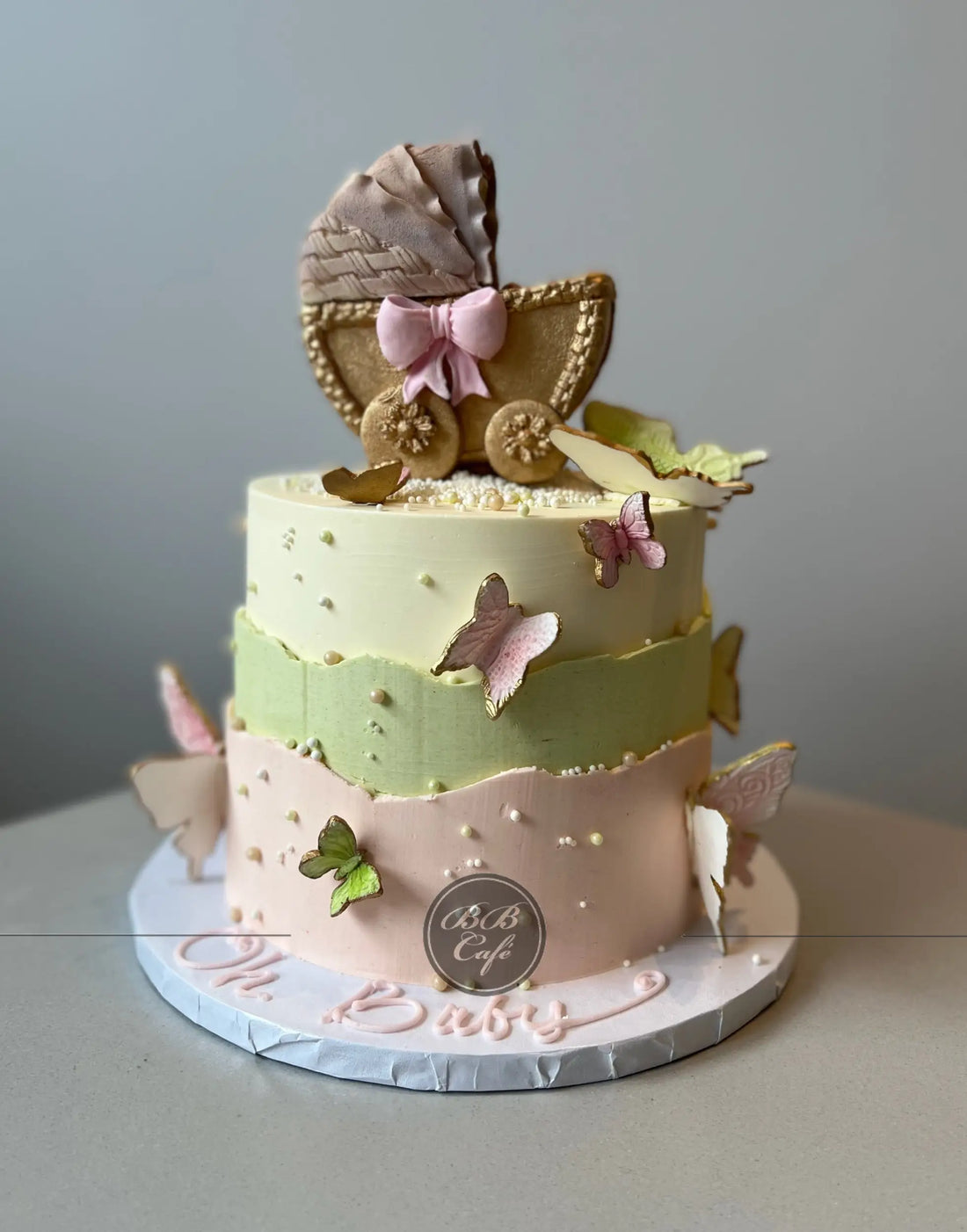 Bassinet &amp; butterfly on buttercream - custom cake