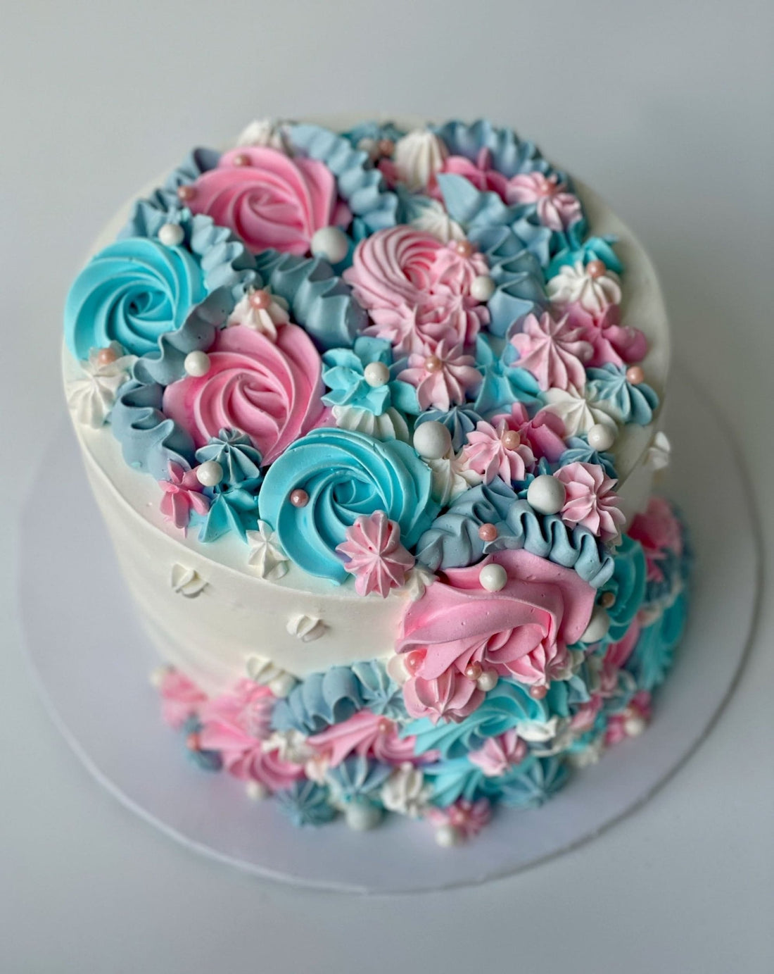 Cascading rosettes in whipped cream - custom cake