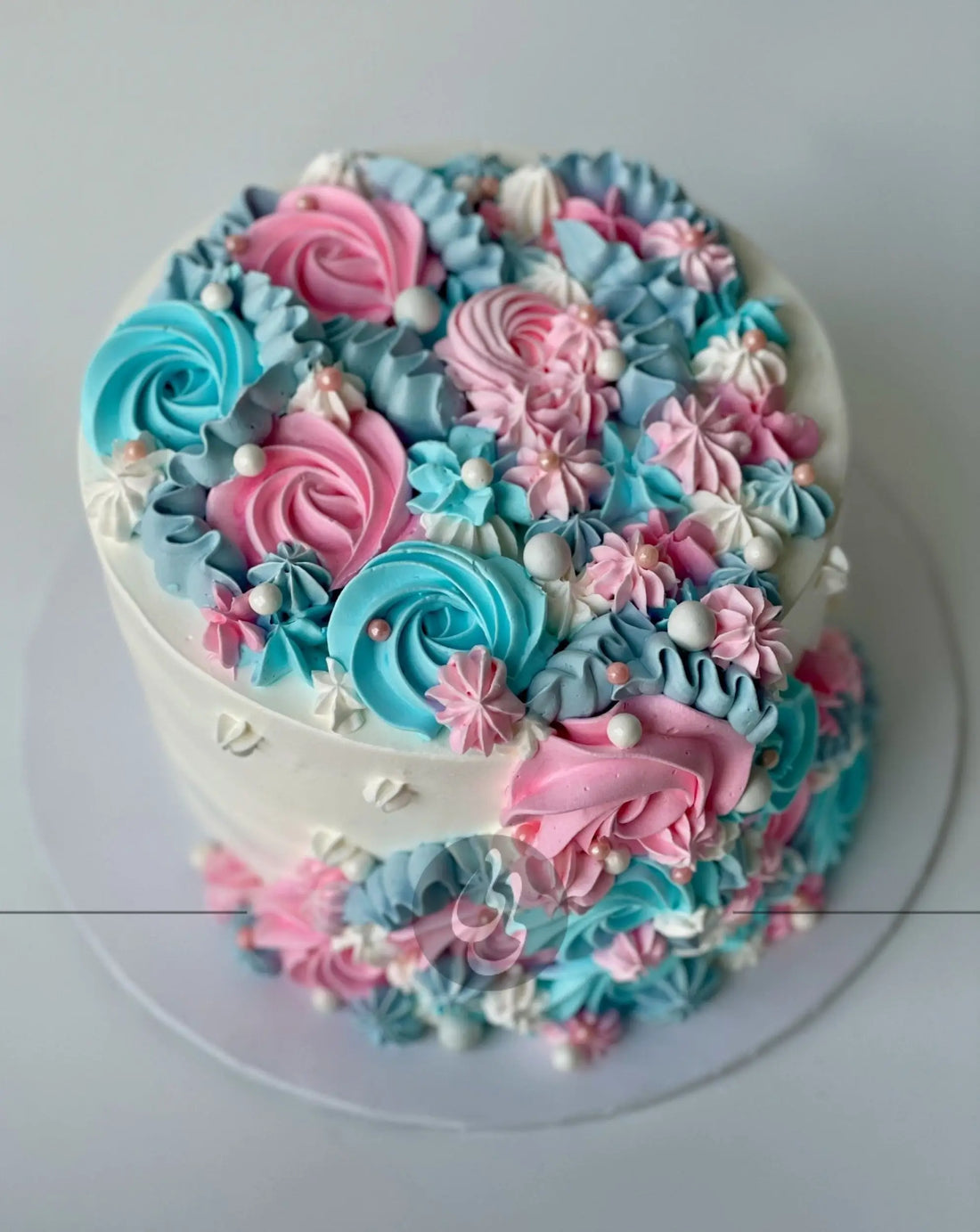Cascading rosettes in whipped cream - custom cake