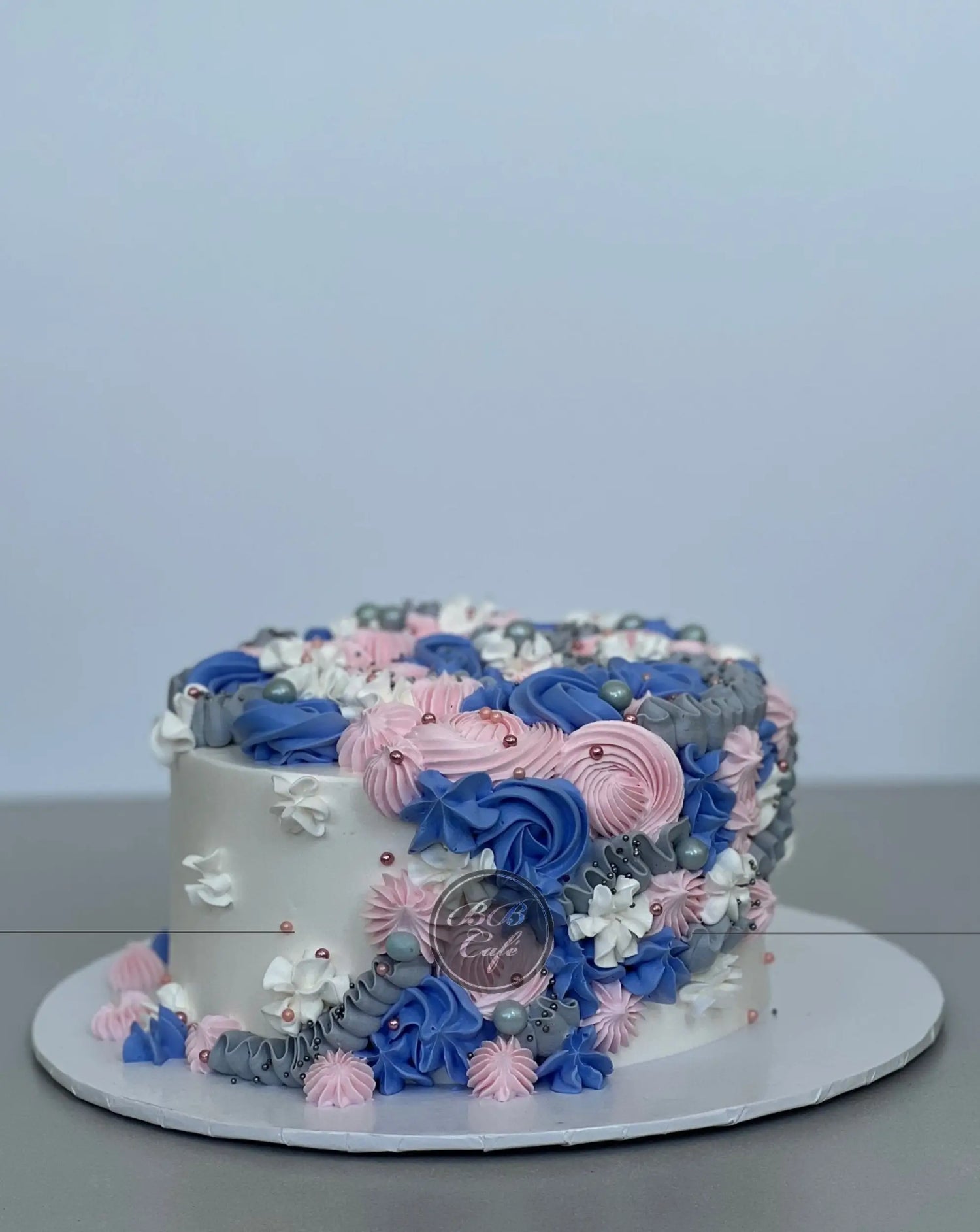 Cascading rosettes in whipped cream - custom cake