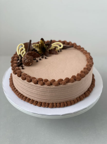 Chocolate decorations on whipped cream - custom cake
