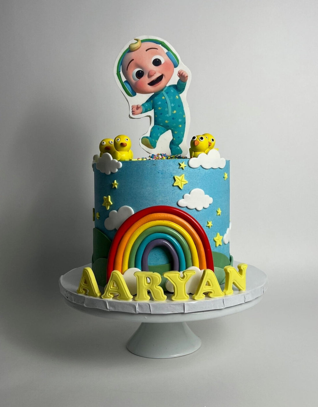Cocomelon jj & rainbow in edible print - custom cake
