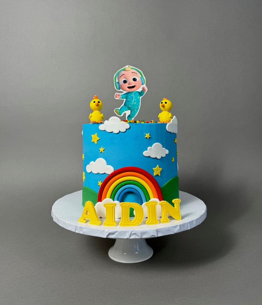Cocomelon jj &amp; rainbow in edible print - custom cake