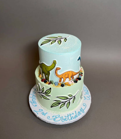 Dinosaur print &amp; leaves on buttercream - custom cake
