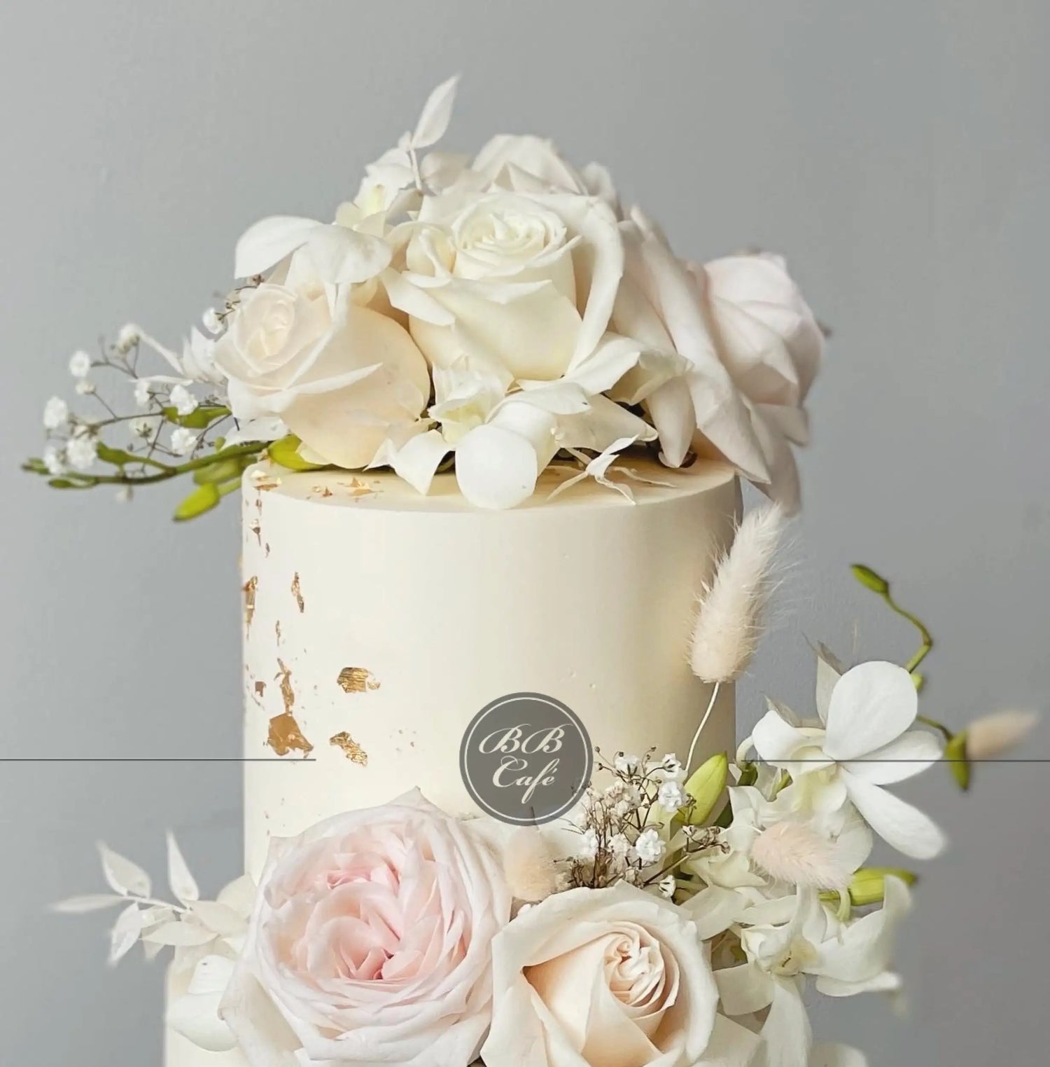 Fresh blooms on buttercream - wedding cake