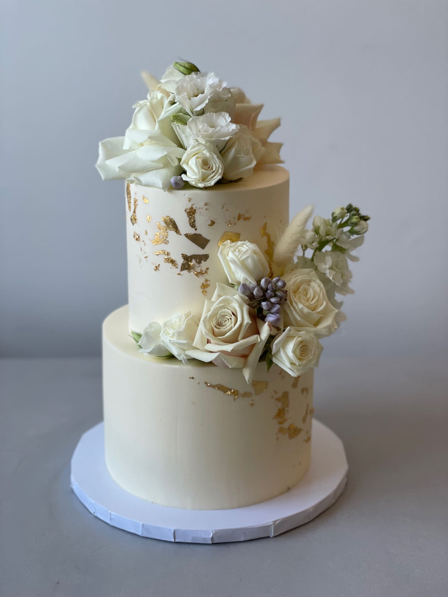 Fresh blooms on buttercream - wedding cake