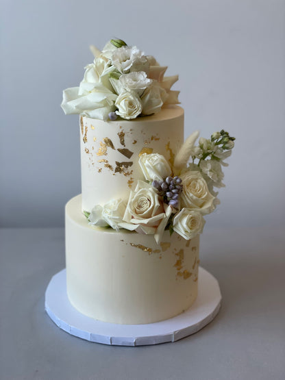 Fresh blooms on buttercream - wedding cake